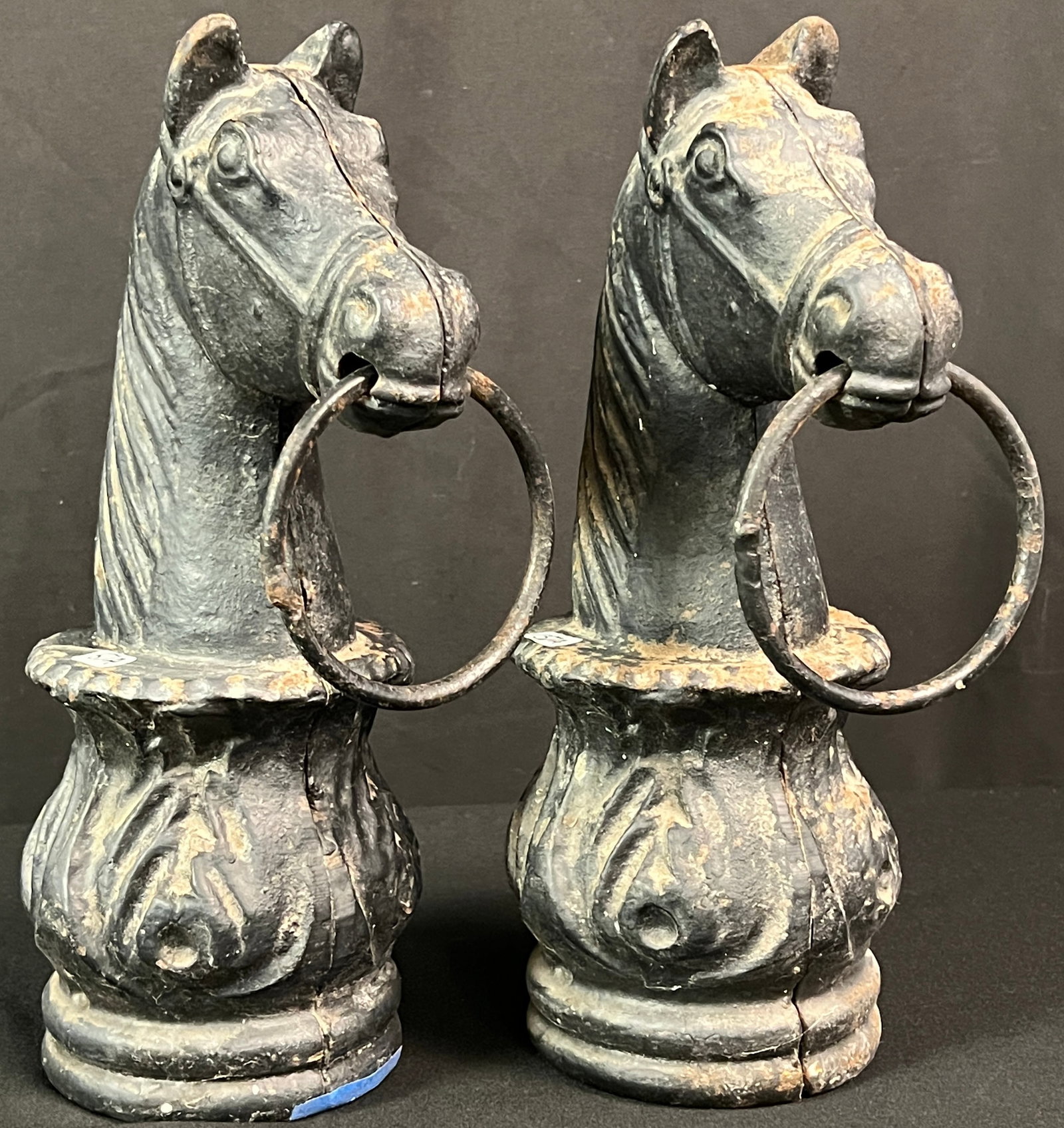 2 Cast Iron Horse Head Hitching posts c.1800's: A pair of matching antique cast iron horse head hitching posts circa 1800's in very good condition. They each measure 13 " tall X 5" across,