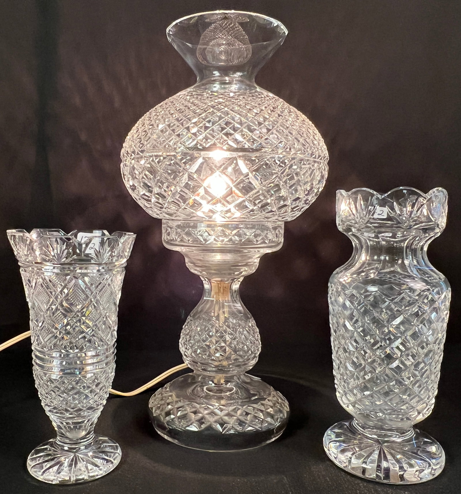 Waterford Fairy Lamp and 2 Footed Vases: A rare Waterford crystal Inishmaan table lamp, measuring 14" tall X 7.5" across. 2 Waterford footed vases, one in the Clare pineapple cut pattern, measuring 8.5" tall X 3.5" across. The other is a