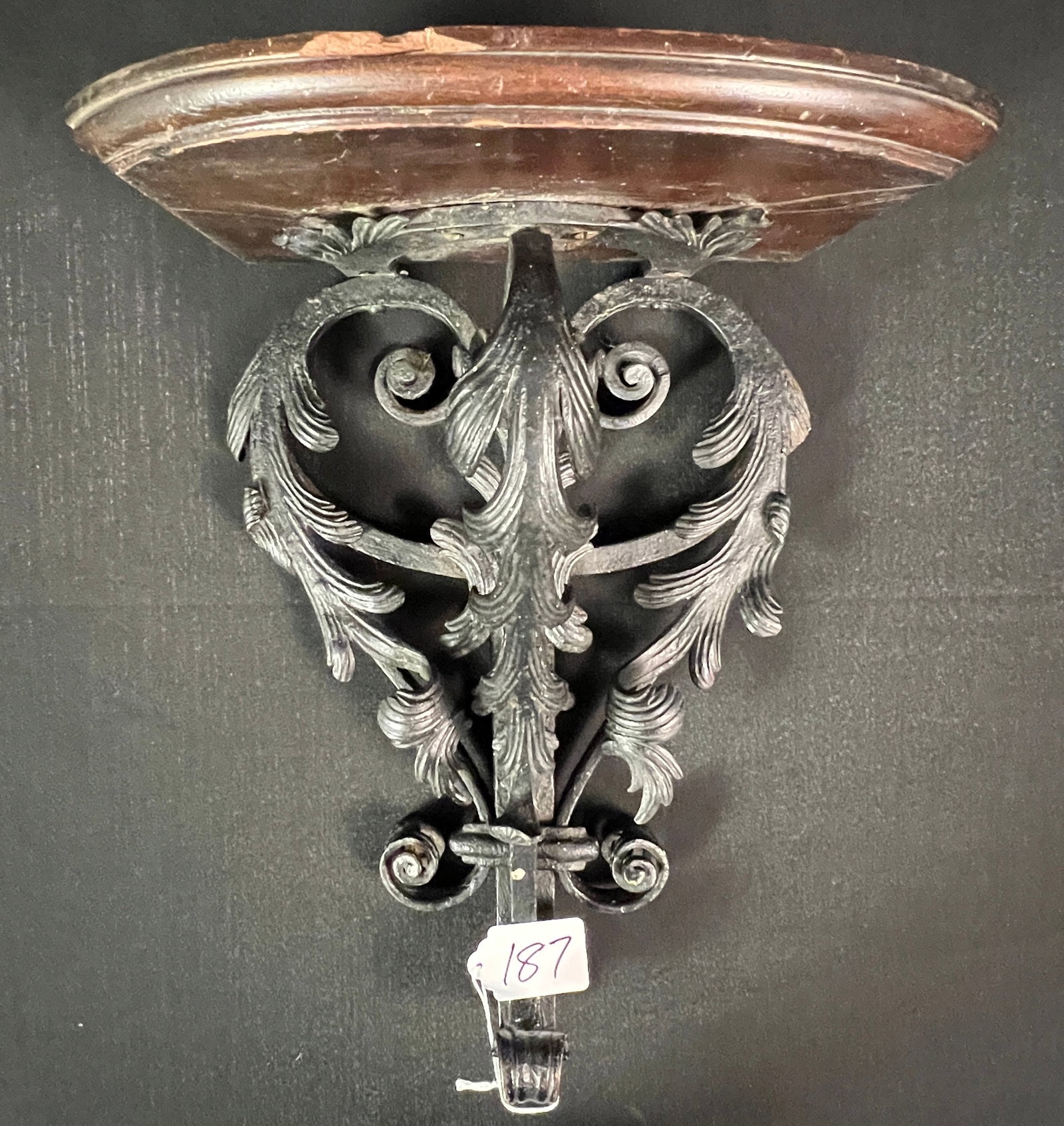 Cyril Colnik - Berlinwork Wall Shelf: A Cyril Colnik iron, hand-tooled berlin work wall shelf with replaced mahogany top shelf. In excellent condition, it measures 15" tall X 10" across X 8.5" deep. This noted Milwaukee blacksmith was