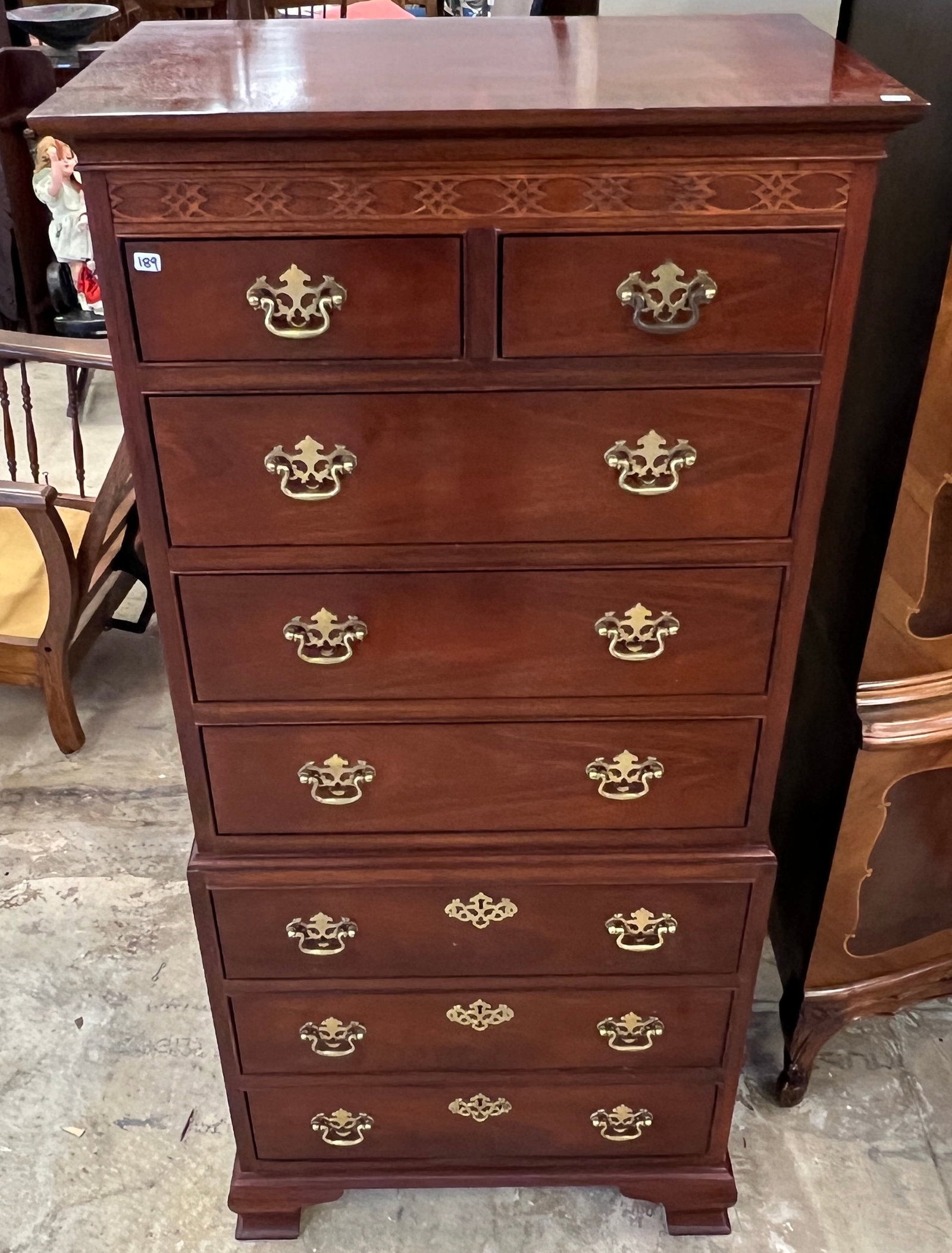 Baker Chinese Chippendale Lingerie Chest: A Baker furniture 8 drawer lingerie chest with Chinese Chippendale decoration. It measures 54" tall X 25" across X 16" deep.