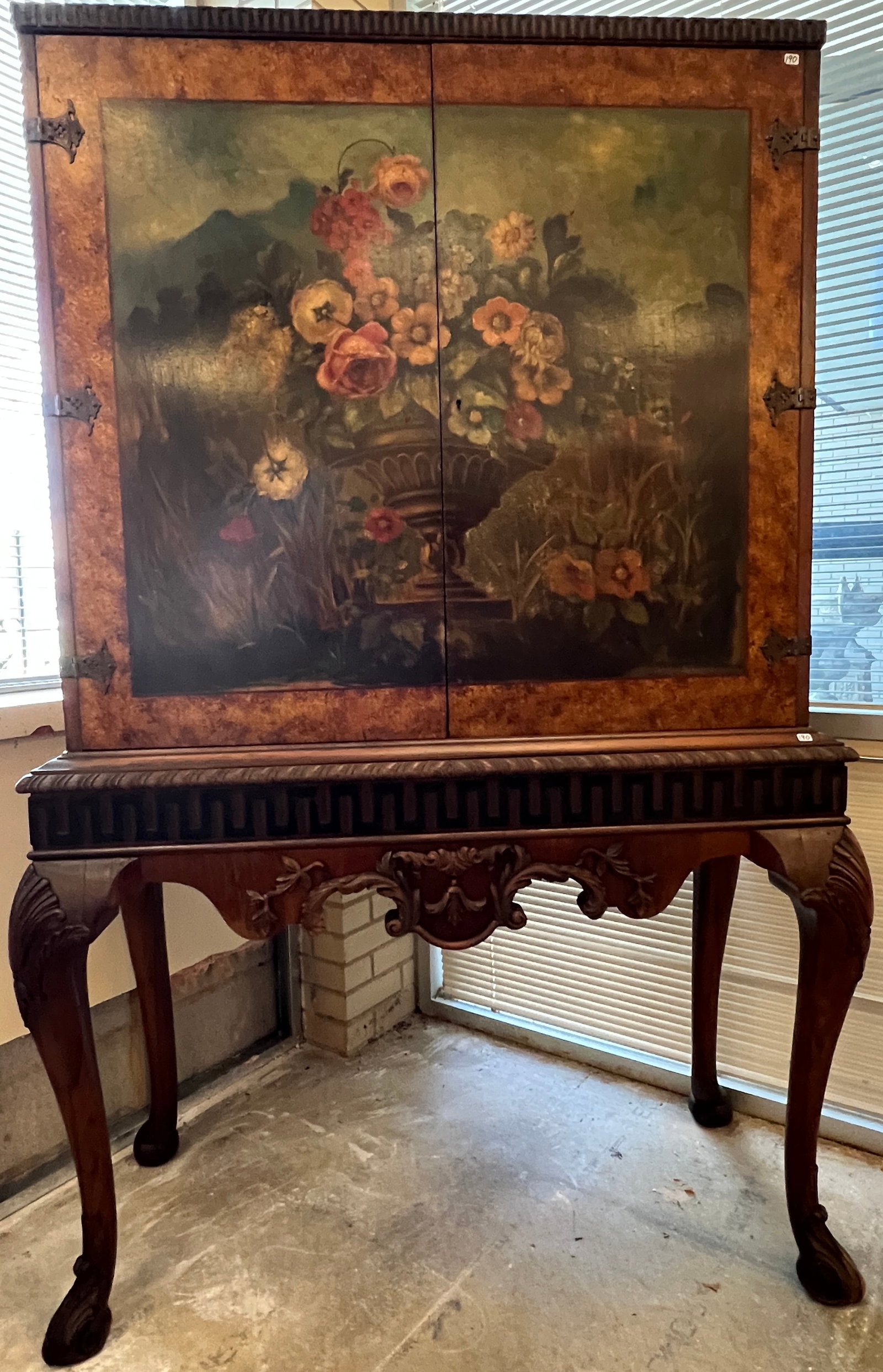 Berkey and Gay Hand Painted Queen Anne China Hutch: A floral hand painted Queen Anne style China hutch attributed to Berkey and Gay. This cabinet features an elaborately floral painted double door front and features removable shelves. The legs are beau