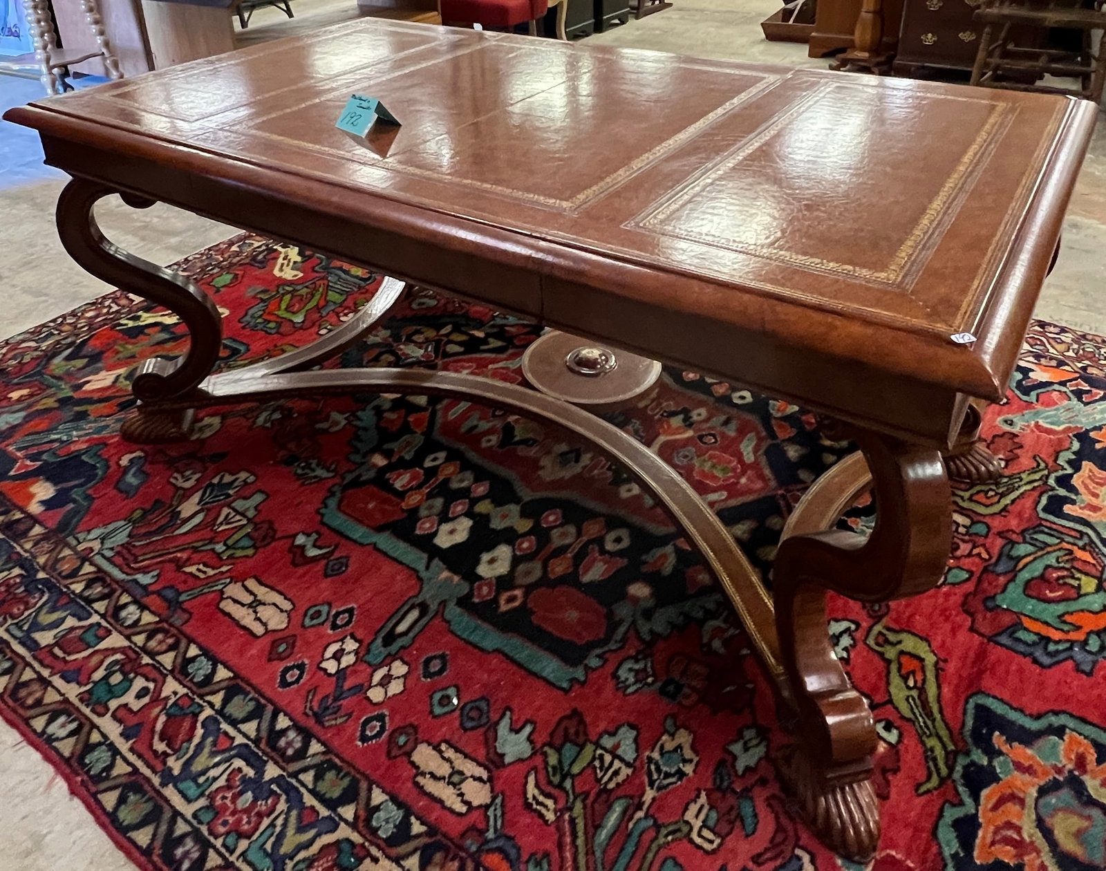 Maitland-Smith Plat Desk: An unusual Maitland-Smith single drawer plat desk or library table with elaborate serpentine legs, fancy stretcher and full leather covered. This designer desk was offered through the Merchandise Mart
