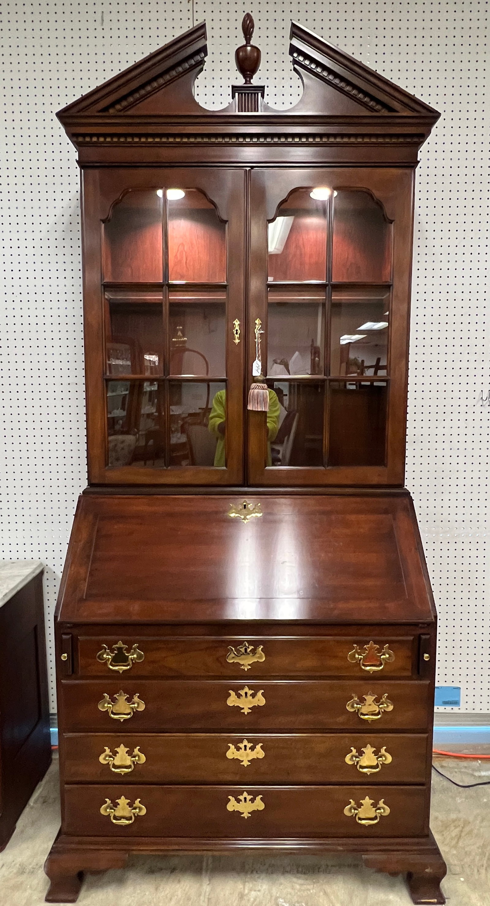 Statton Cherry Secretary: An American Chippendale 4 drawer drop front secretary by Statton Furniture with bookcase top and arched pediment. The drop front opens up to an elaborate drawered interior. All in original finish,