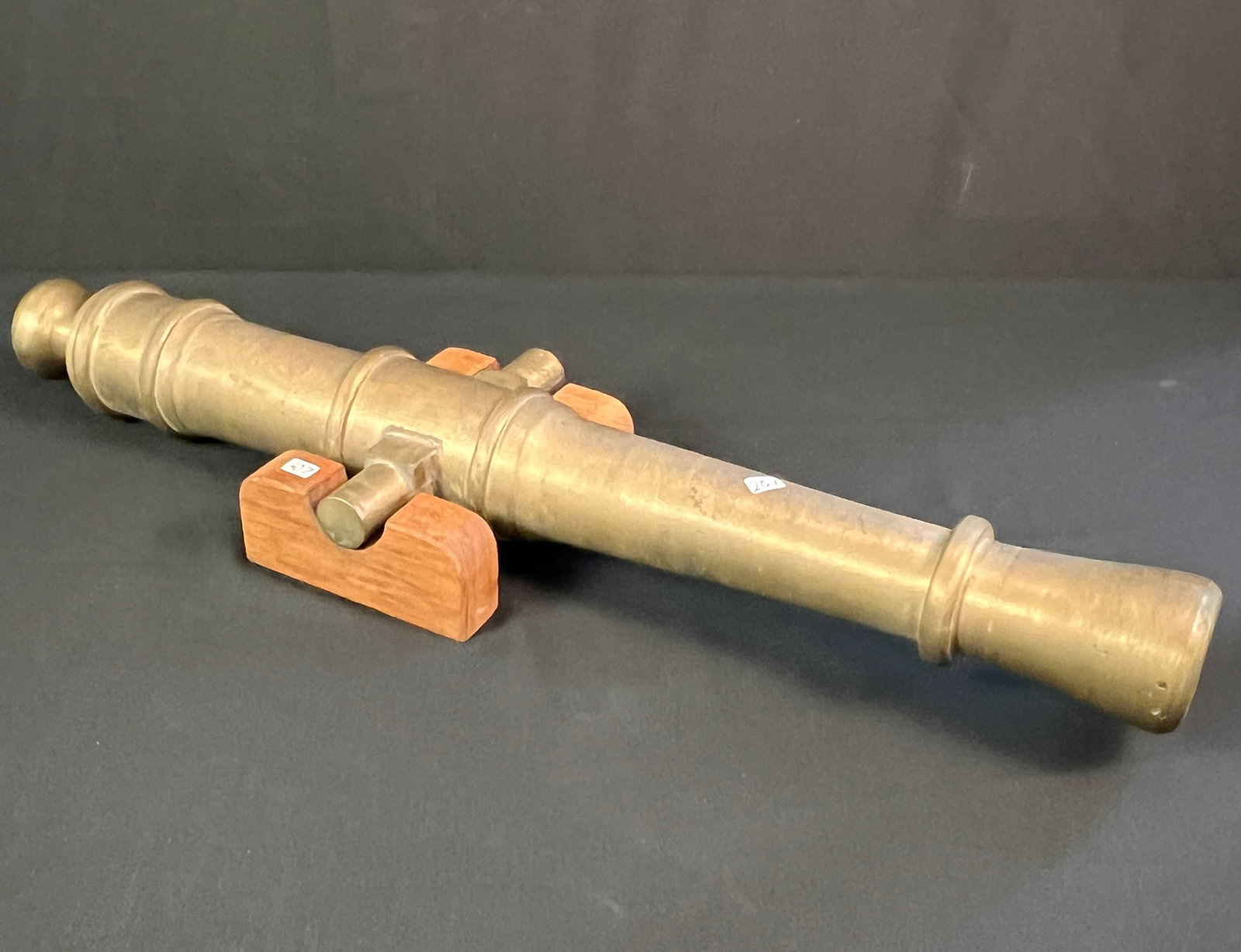 Polished Brass Cannon: A polished brass 4th of July cannon. This custom designed cannon was a Boys Tech shop project overseen by Mr. Gallun, head of shop. It is currently not working, but can be made to work by drilling a