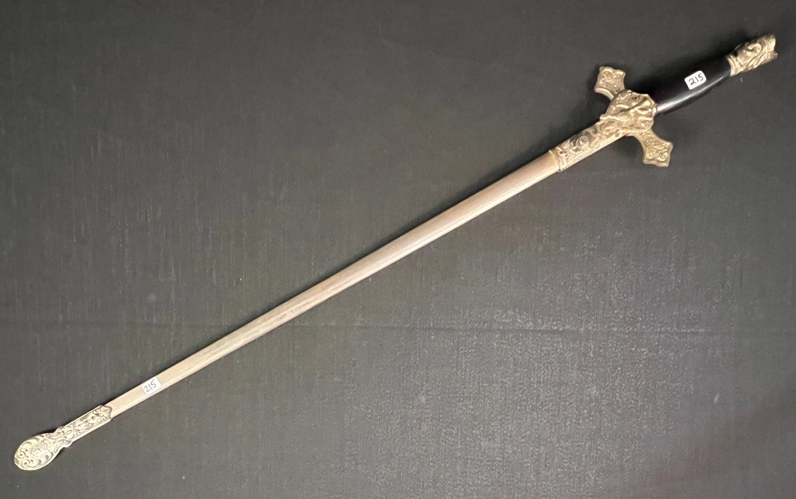 Knights of Columbus Ceremonial Sword: An antique Knights of Columbus ceremonial sword with original sheath, elaborate engraving on blade and makers mark "Lynch & Kelly of Utica NY."