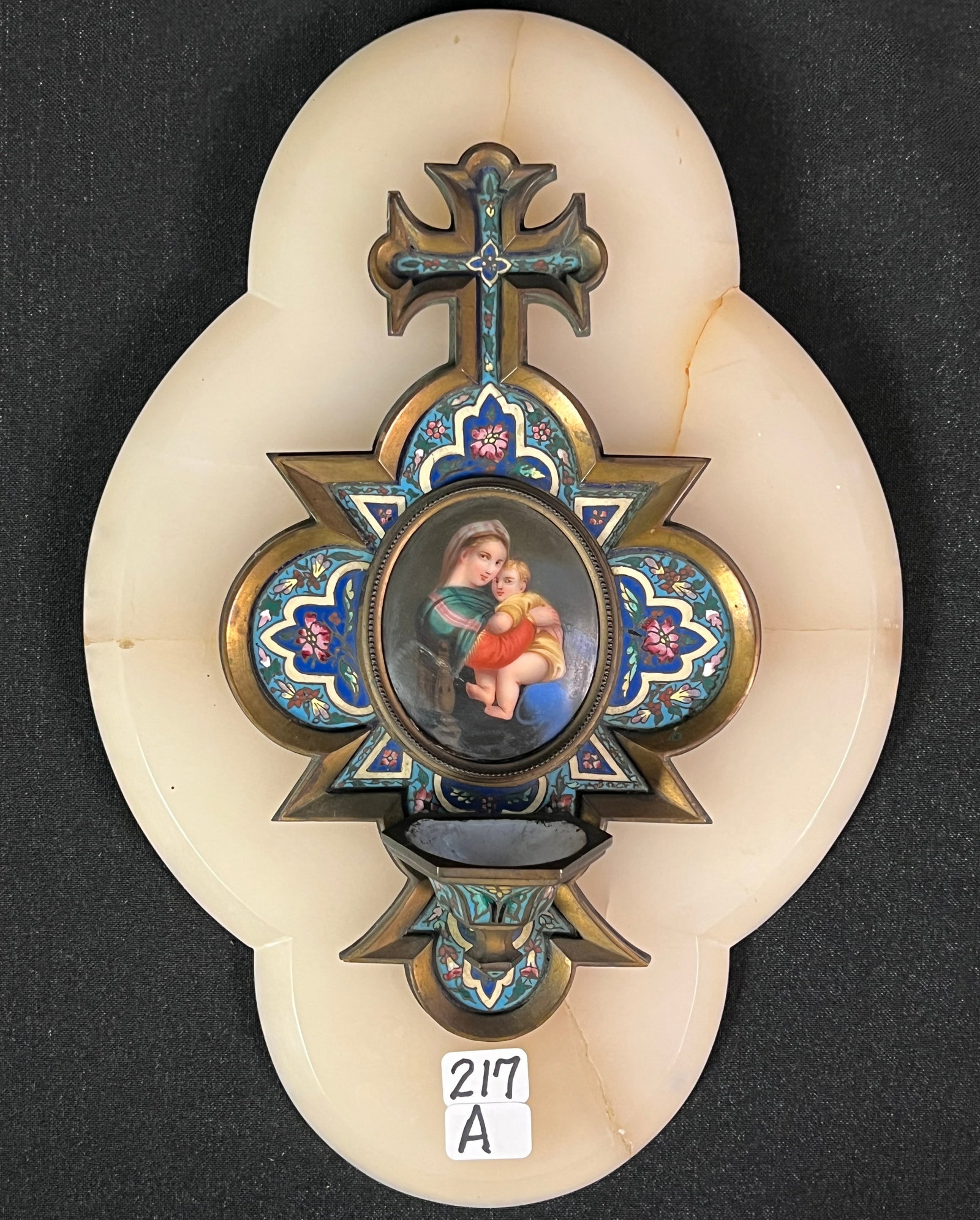 Russian Enamel Holy Water Font: A Russian floral enameled wall hung holy water font with marble back and central hand-painted portrait of Mary and baby Jesus. In excellent condition, it measures 10" tall X 7". Portrait measures 2.25