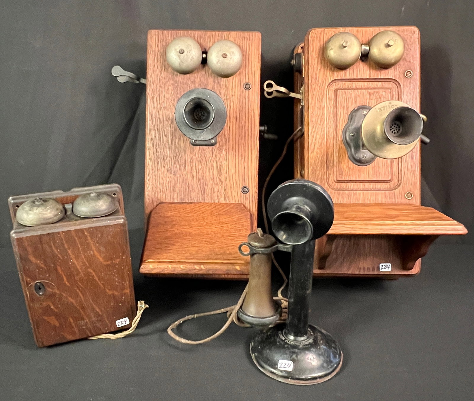 Group of Antique Telephones: A group of antique telephones to include a Western Electric Bell Box wall mount wood phone c 1901, a wood case wall mount phone that includes its transformer box (missing it's speaker),, a complete