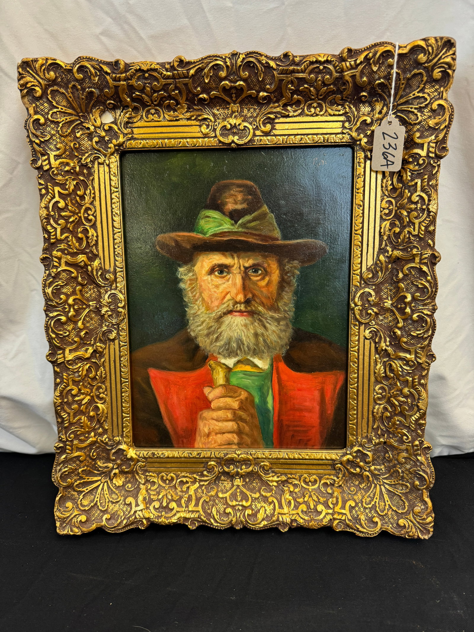 Casper Mine Oil on Board Portrait, Signed: A quality framed oil on Masonite portrait by listed French artists Casper Mine (1905 - ). It depicts a Tyrolean man with a beard in a hat and holding a walking stick. It is signed in the upper right m