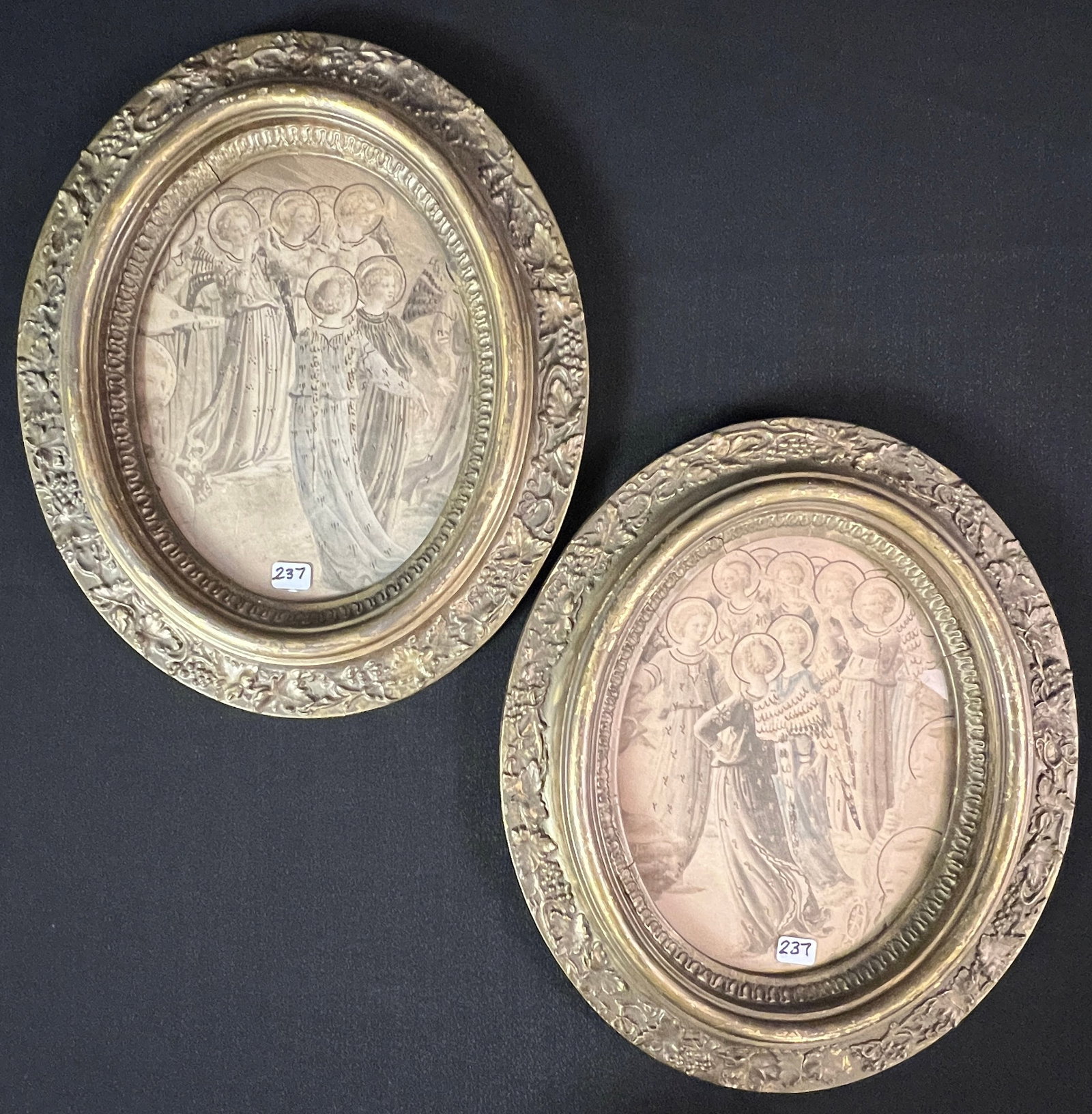 Pair of Oval Frames with Chorus of Angels: A pair of fancy gold leaf 1840/50s frames in excellent condition with hand colored chorus of angels. They both measure 13" tall X 11" across.