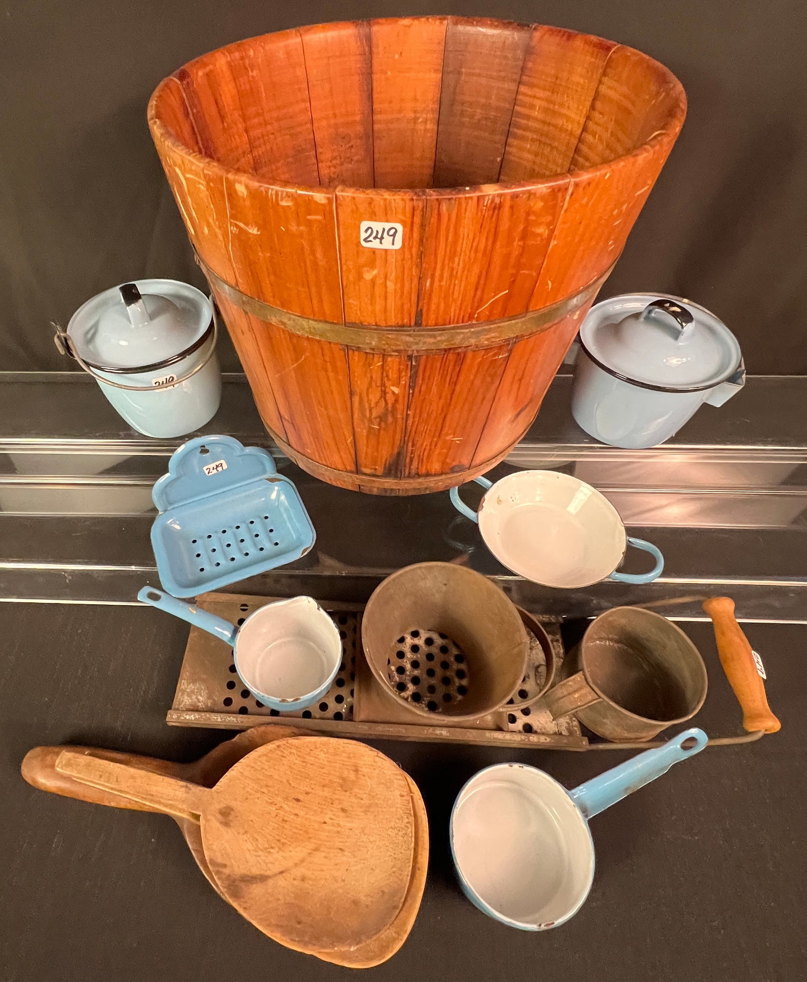 Large Country Collectables Kitchen Lot: A large country collectables kitchen lot to include splayed and banded wood bucket, 3 handmade wooden scoops, an unusual grater (rusted), blue enameled soap dish w/ drain, 2 miniature covered