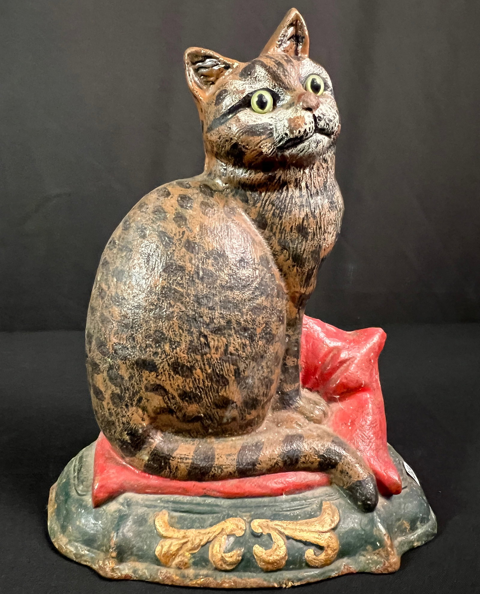 Cast Iron Cat Door Stop: A vintage cast iron painted cat door stop with applied glass eyes. It measures 12.5" tall.