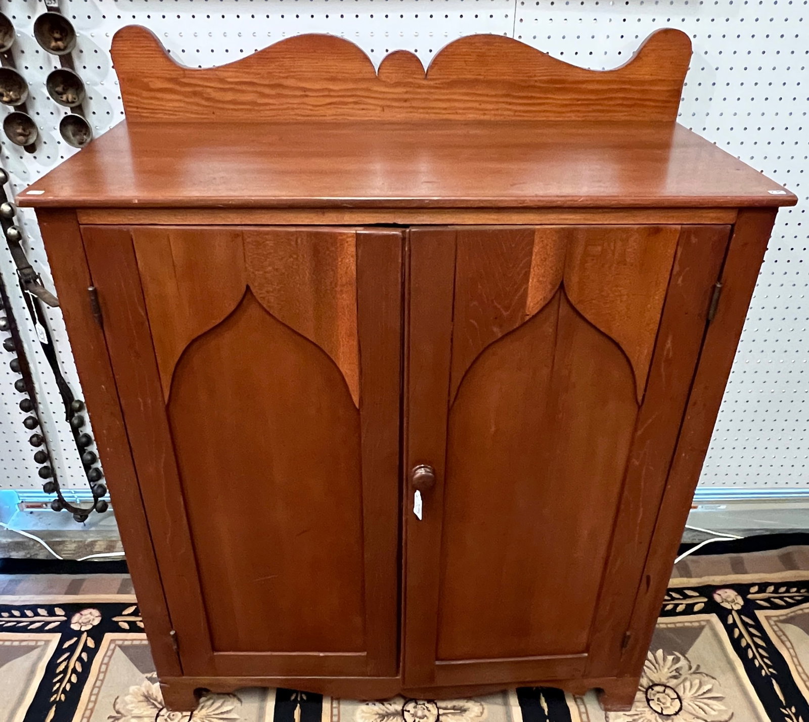 Cherry Preserving Cupboard: A cherry pre-Civil War double-door preserving cupboard with fancy backsplash, with 2 shelf interior. In good condition, adjustments need to be made to the door. It measures 41" tall X 39" across X