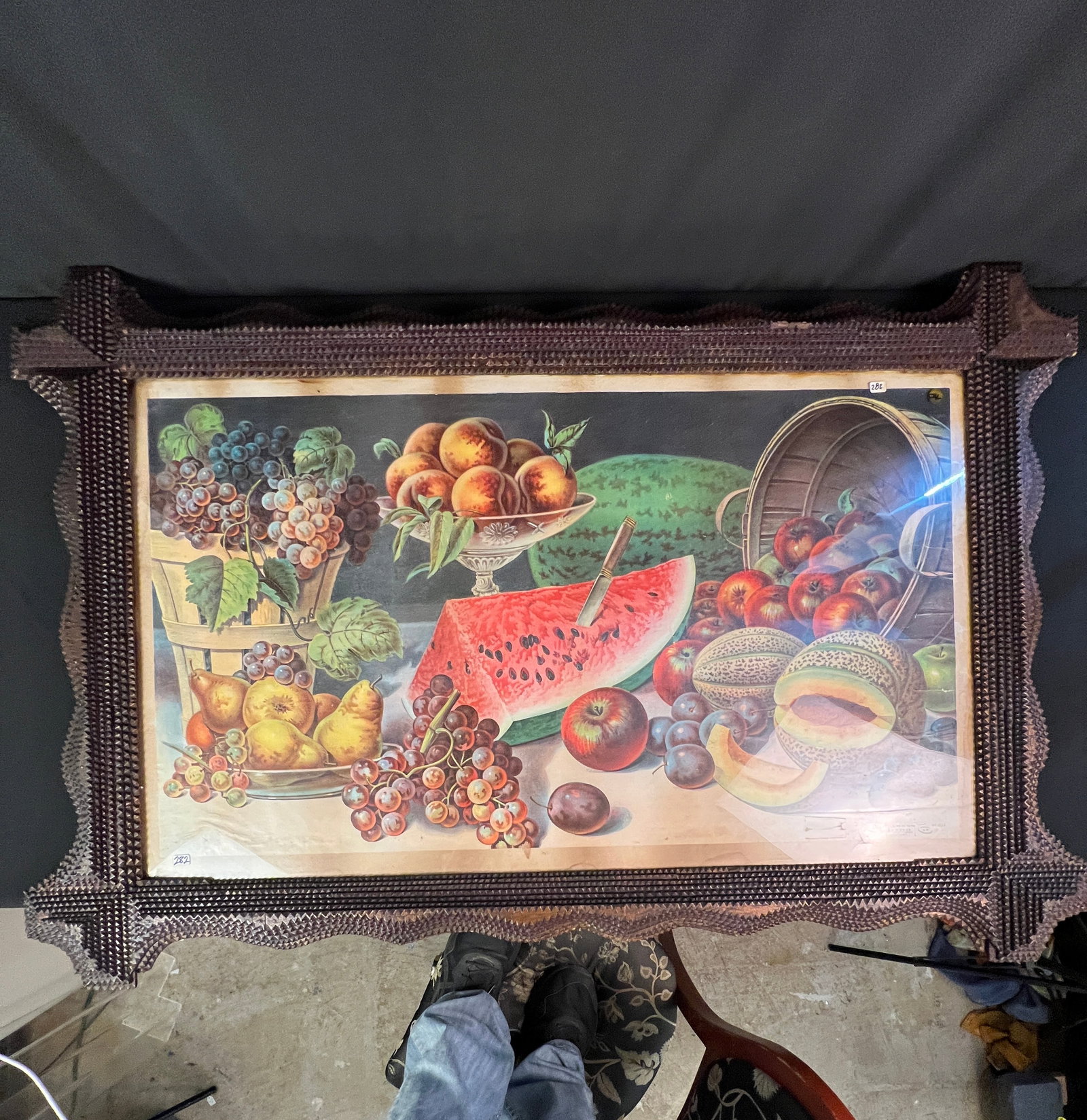 Large Folk Art Tramp Art Frame: A large Tramp art frame c.1900 with a Donaldson Lithograph of a fruit still life under glass in good condition with minor age losses noted..