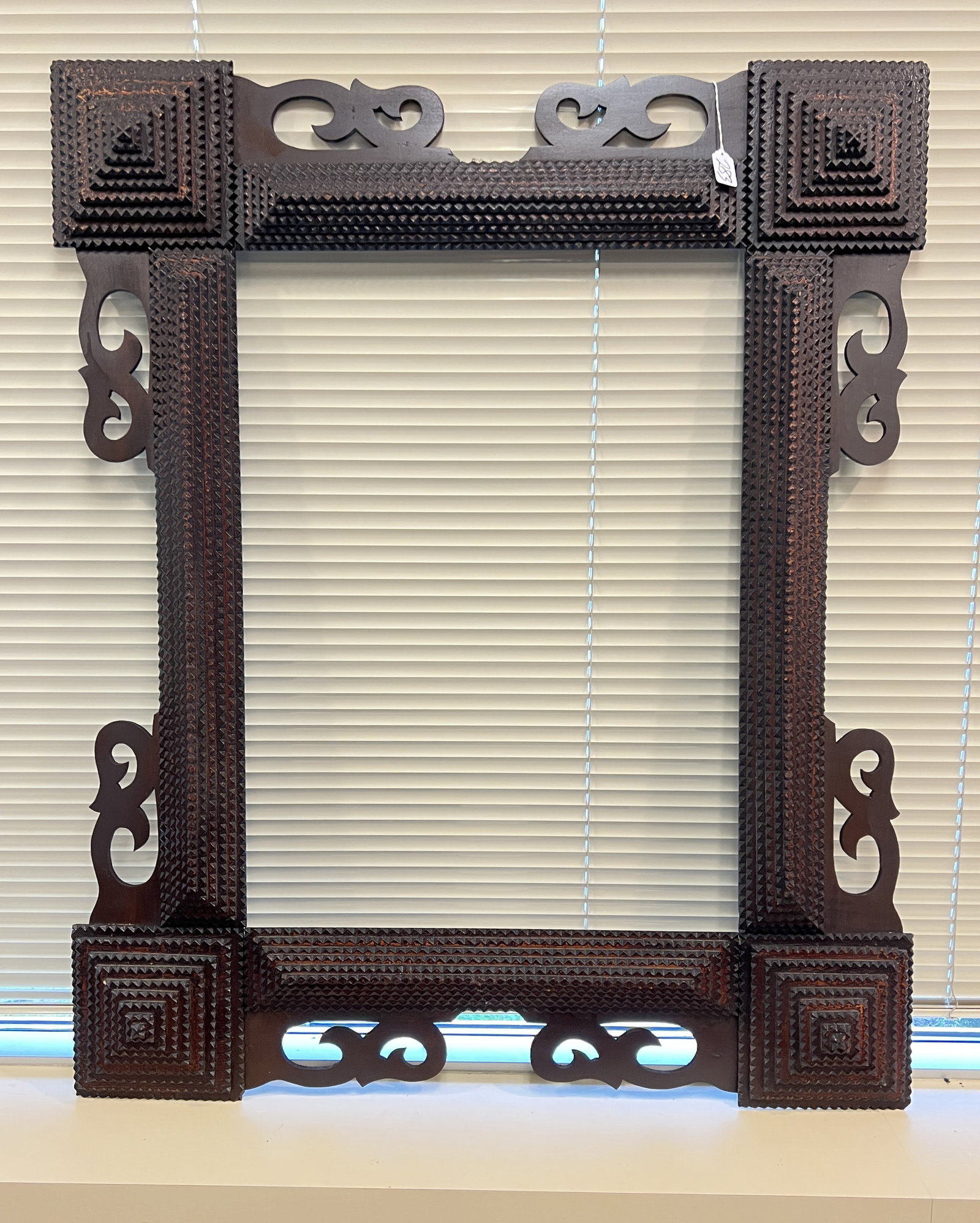 Elaborate Tramp Art of Important Size: An elaborate tramp art frame of important size. This frame features excellent workmanship and overall is in excellent condition and measures 45" X 37". Would make an excellent frame for a mirror or ar