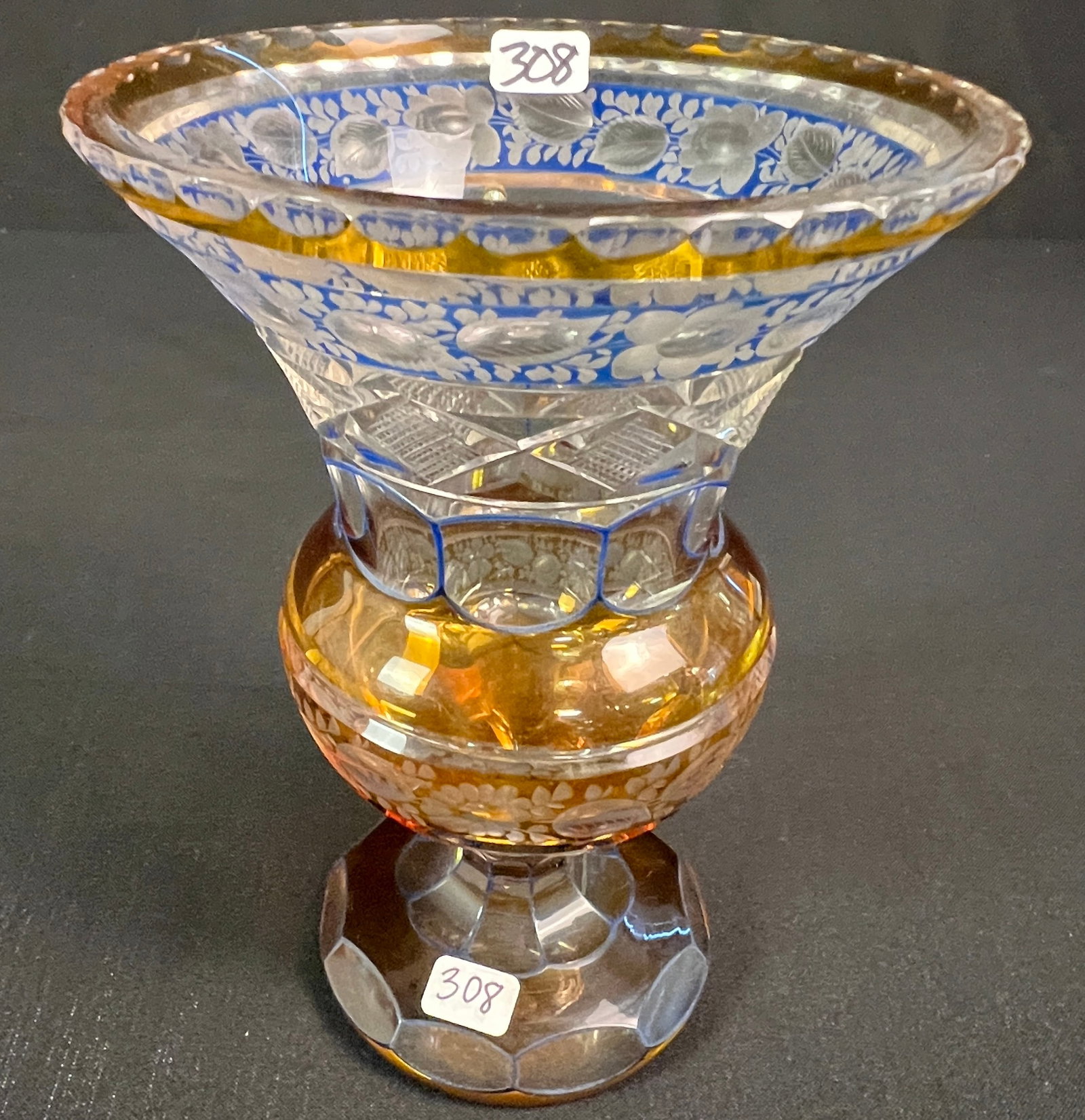 Moser Bohemian Glass Vase c.1900-20s: A Moser bohemian glass vase hand-engraved with a scalloped cut edge, cut-to-clear, floral cut relief, cuts are trimmed in blue enamel floral pattern. In excellent condition it measures 7.75" tall X