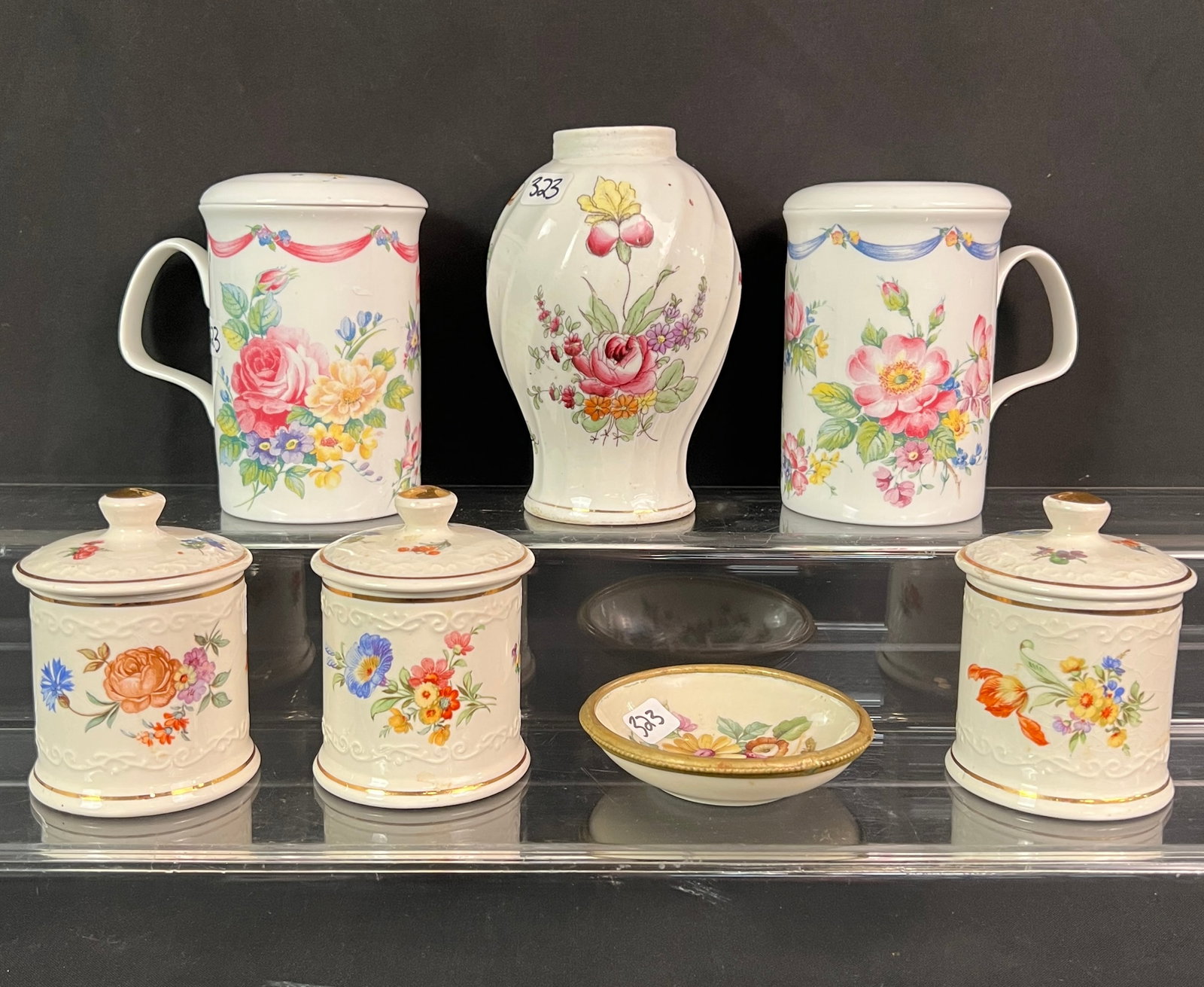 Group of English Porcelain and More: A group of English porcelain to include a pair of Roy Kirkham fine bone china mug and matching lid in the "Dresden Sprays" pattern featuring a vibrant floral design, set of 3 Crown Devon ceramic pots 