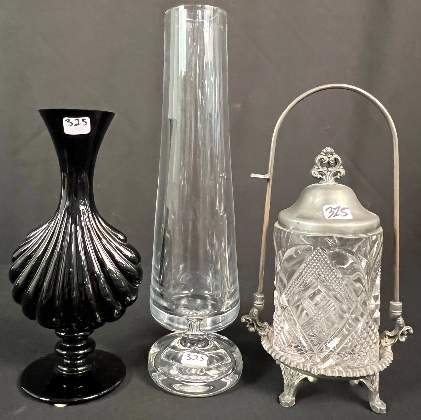 Two Vintage Baccarat Vases: Two vintage signed Baccarat vases to include a black crystal long neck vase with shell form in excellent condition and measures 8.5" tall X 4.25" wide. To also include a Soliflor vase, c.1960 in excel