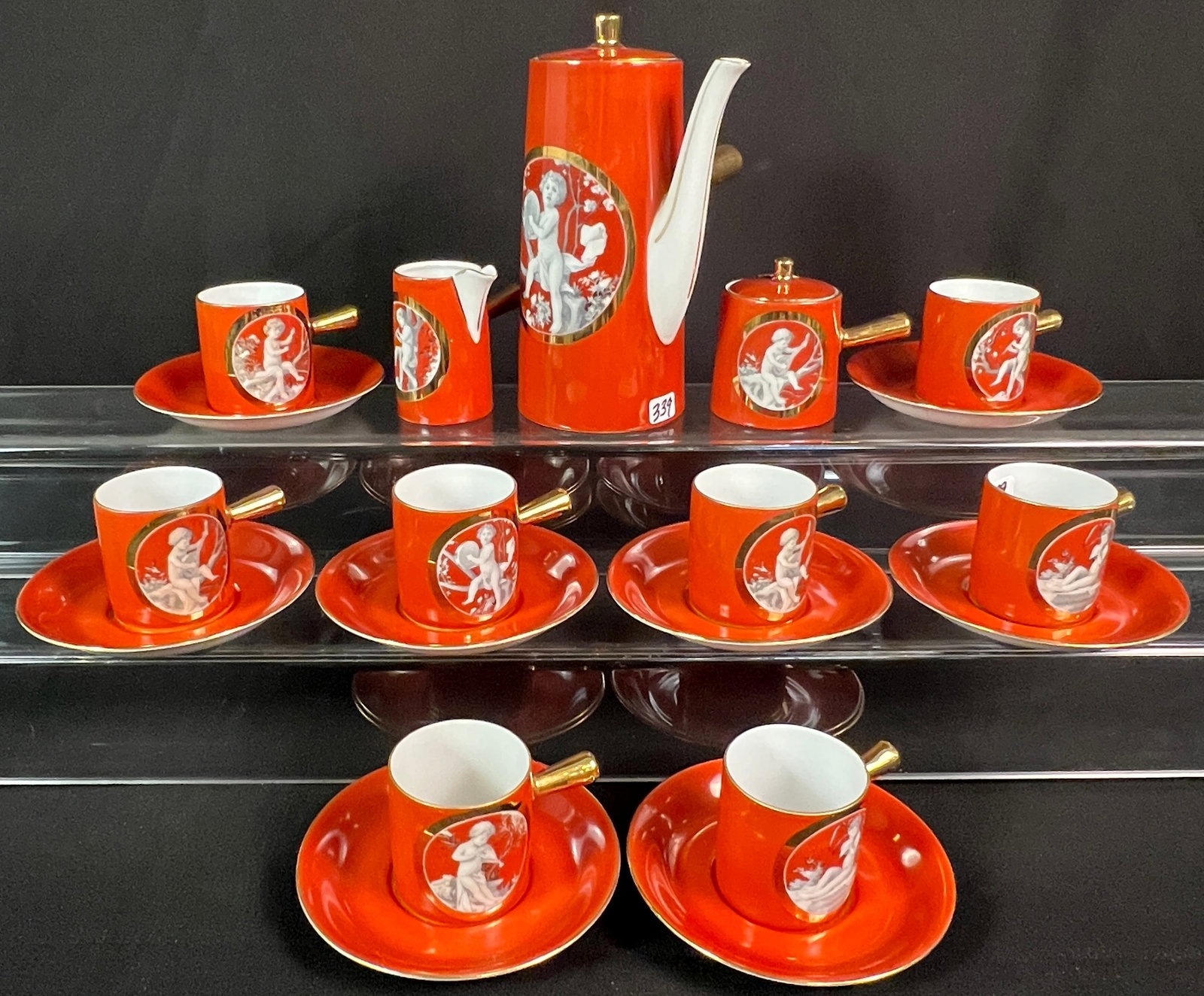 Royal Epiag Porcelain Chocolate Set c.1960's: A Vintage Royal Epiag porcelain Chocolate set c. 1960's that includes Pot, creamer sugar, 8 cups and saucers that feature puti playing instruments, gold trim and gold stick handles in excellent condit