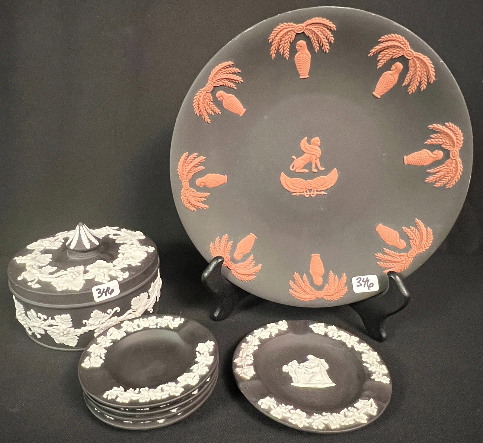 Rare Wedgewood Egyptian Basalt Jasperware Plate, more: A group of Wedgwood Jasperware to include a rare terracotta and basalt 9" Jasperware plate in an Egyptian motif, a black basalt covered trinket box that features a carousel top in the "Grapevine patte