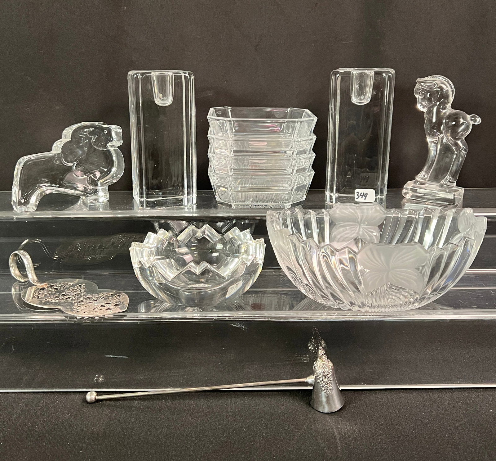 Group of quality Crystal and Glass Furnishings: A group of quality crystal and glass furnishings to include a pair of Kosta Boda Swedish block candleholders (5.5" tall X 2.5" across), A Wallace Baroque candle snuffer , a Rosenthal Studio Linie bowl