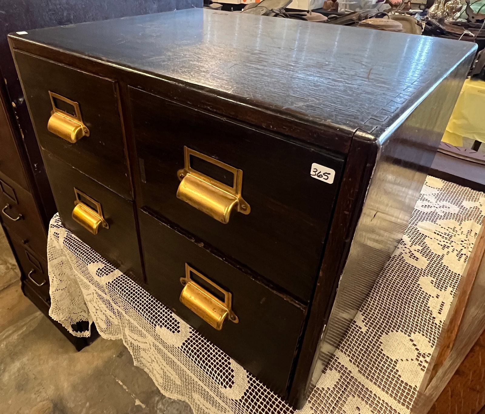 Oak Four Drawer Card File: An oak, dark stained four drawer dovetailed card file. In good condition, it measures 15" tall X 22" across X 17" deep.