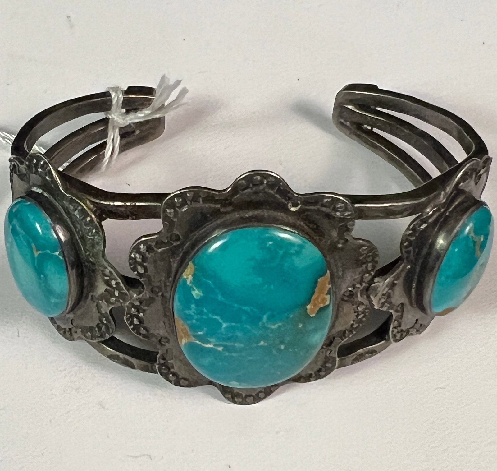 Silver Navajo Turquoise Cuff Bracelet c. 1930: An outstanding silver Navajo turquoise cuff bracelet c. 1930. The stones featured in this piece appear to be old deposit turquoise from mine #8. Bracelet is unmarked, in excellent condition and is a p