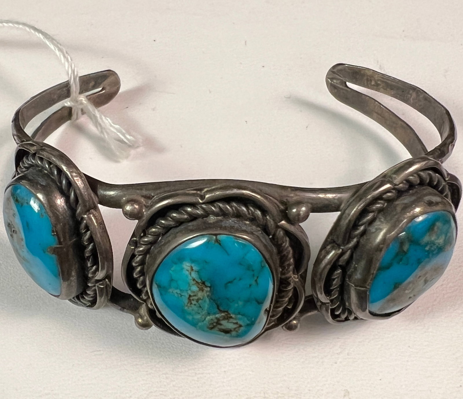 Silver Navajo Old Mine Turquoise Cuff Bracelet c. 1930: An outstanding silver Navajo turquoise cuff bracelet c. 1930. The stones featured in this piece appear to be old deposit turquoise from mine #8. Bracelet is unmarked, in excellent condition and is a p