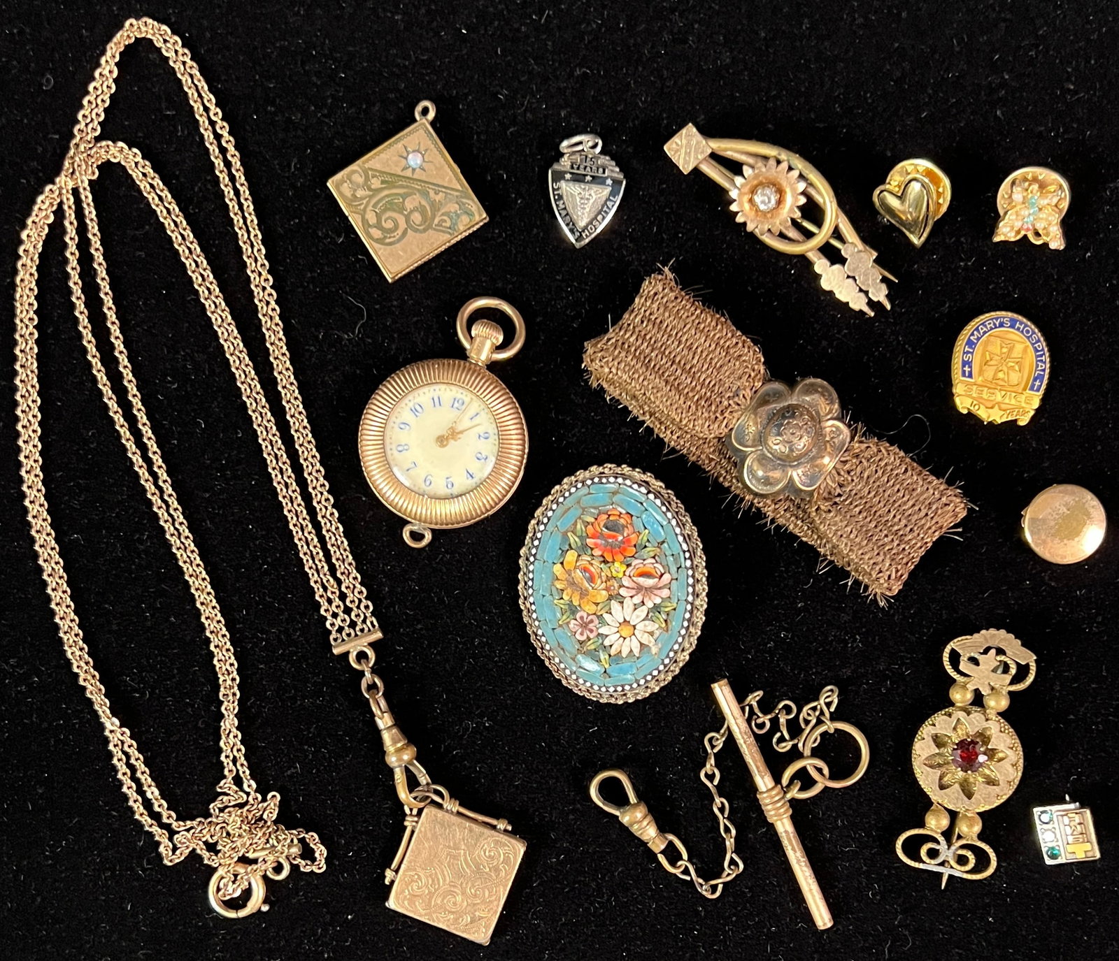 Victorian Jewelry Group to Include Hair Jewelry and More: A group of Victorian jewelry to include a gold filled hair bracelet, lockets, ladies watch, gold filled Victorian pins, chains, commemorative pins and more.