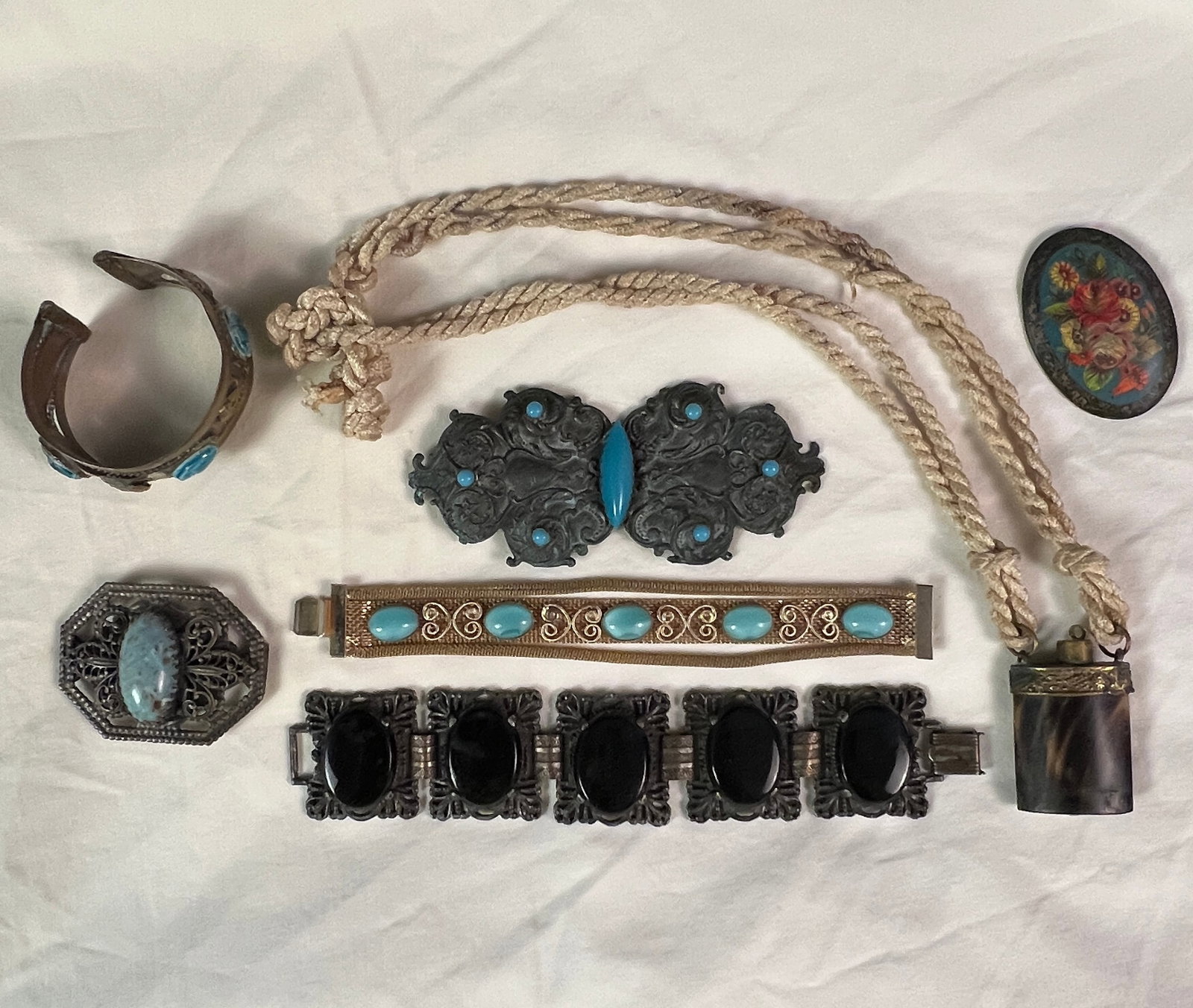 Vintage Scarab Cuff Bracelet, Belt Buckle and More: A group to include a copper and brass Egyptian Revival cuff bracelet, a Victorian faux turquoise belt buckle, brooch, bracelets and horn snuff bottle.
