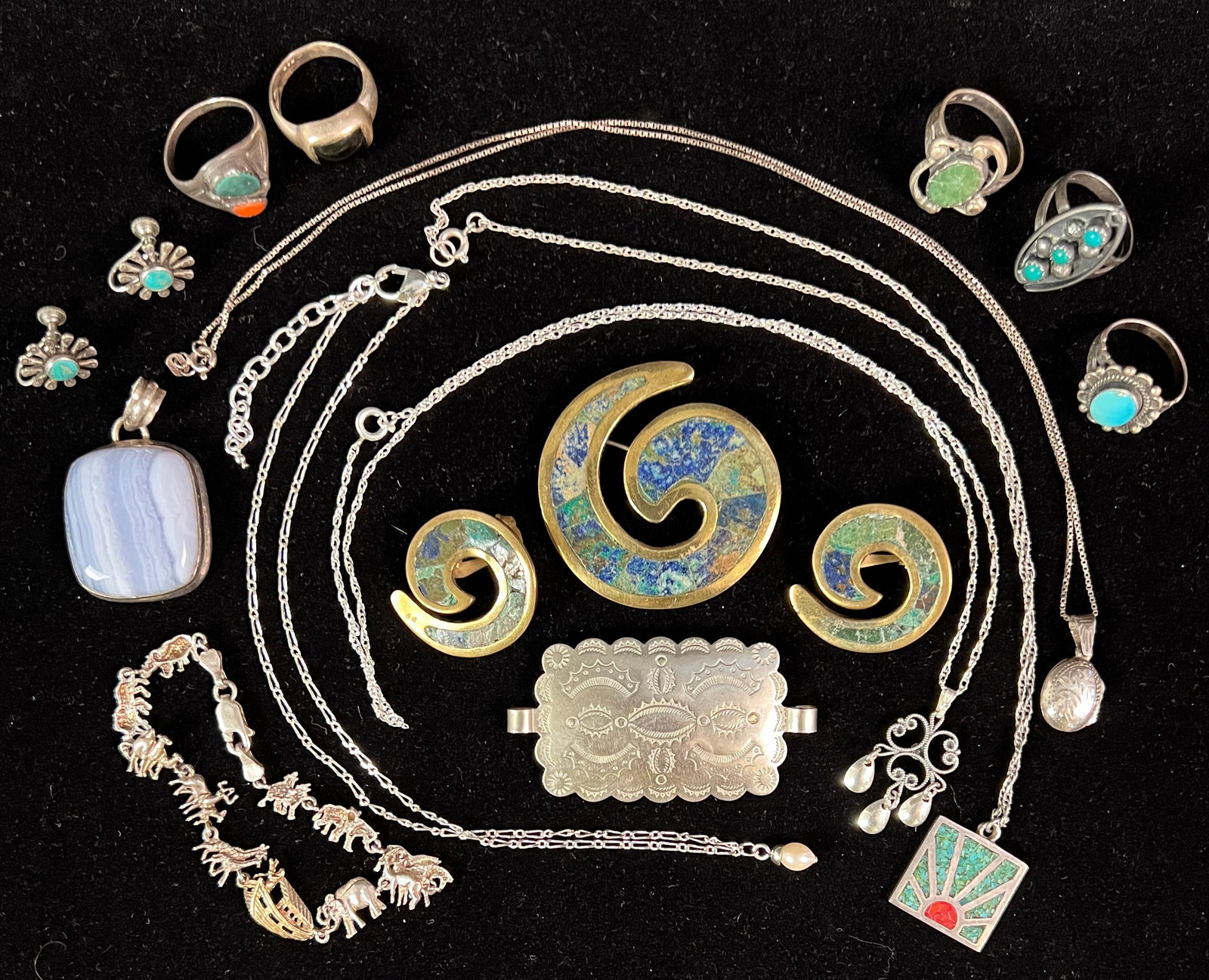 Navajo and Other Assorted Sterling Jewelry: A group of sterling jewelry to include 5 southwest stone rings, signed Navajo earrings, inlaid necklace, inlaid brooch with matching earrings, stone pendant, locket necklace, bracelet and more.