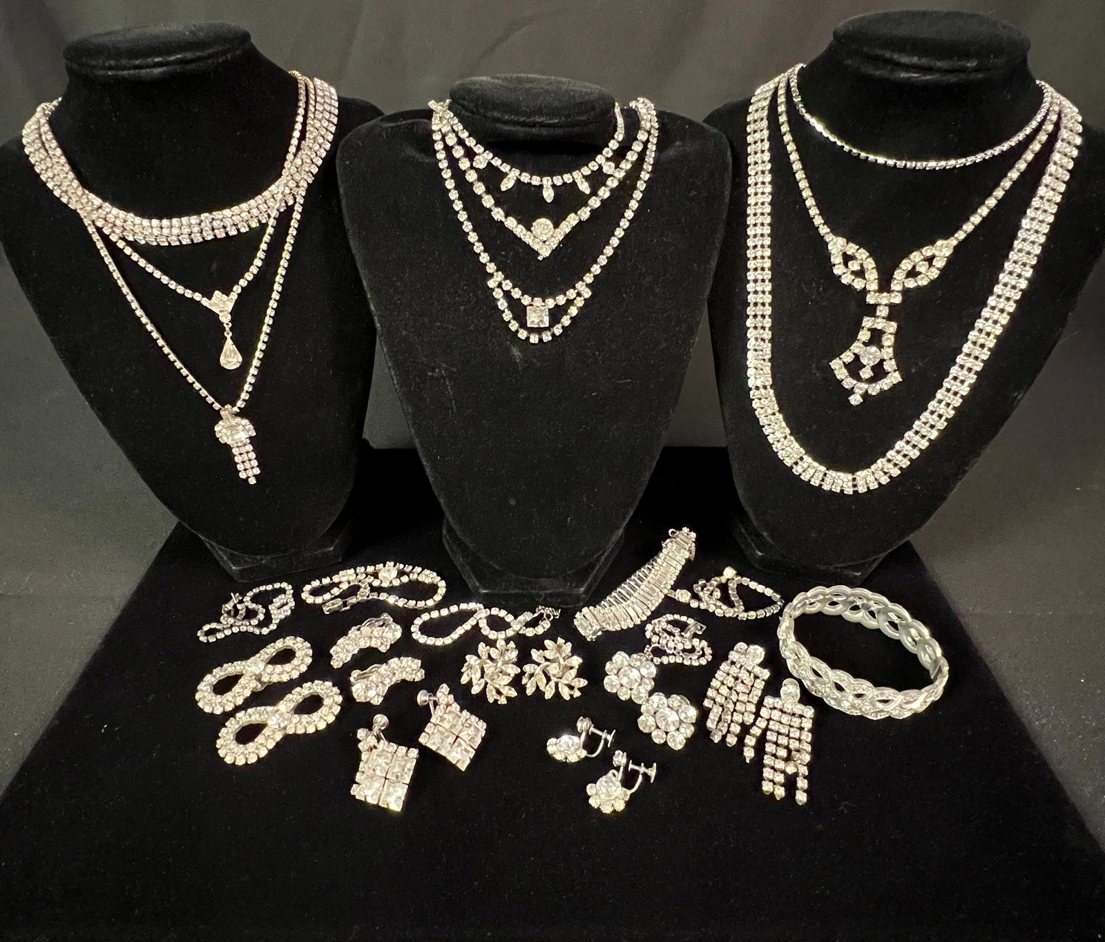 Large White Rhinestone Lot: A large white rhinestone lot to include bracelets, clip on & screw back earrings, necklaces and more. All in great condition.