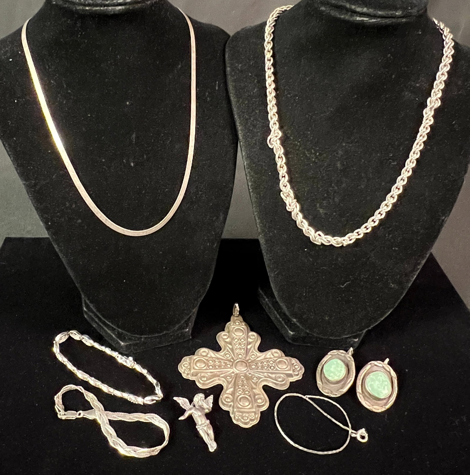 Group of Sterling: A group of sterling to include a heavy 925 necklace, 2 sterling bracelets, a pair of sterling and turquoise cufflinks, a sterling Reed & Barton Christmas ornament 1972, and an angel pendant. All in go
