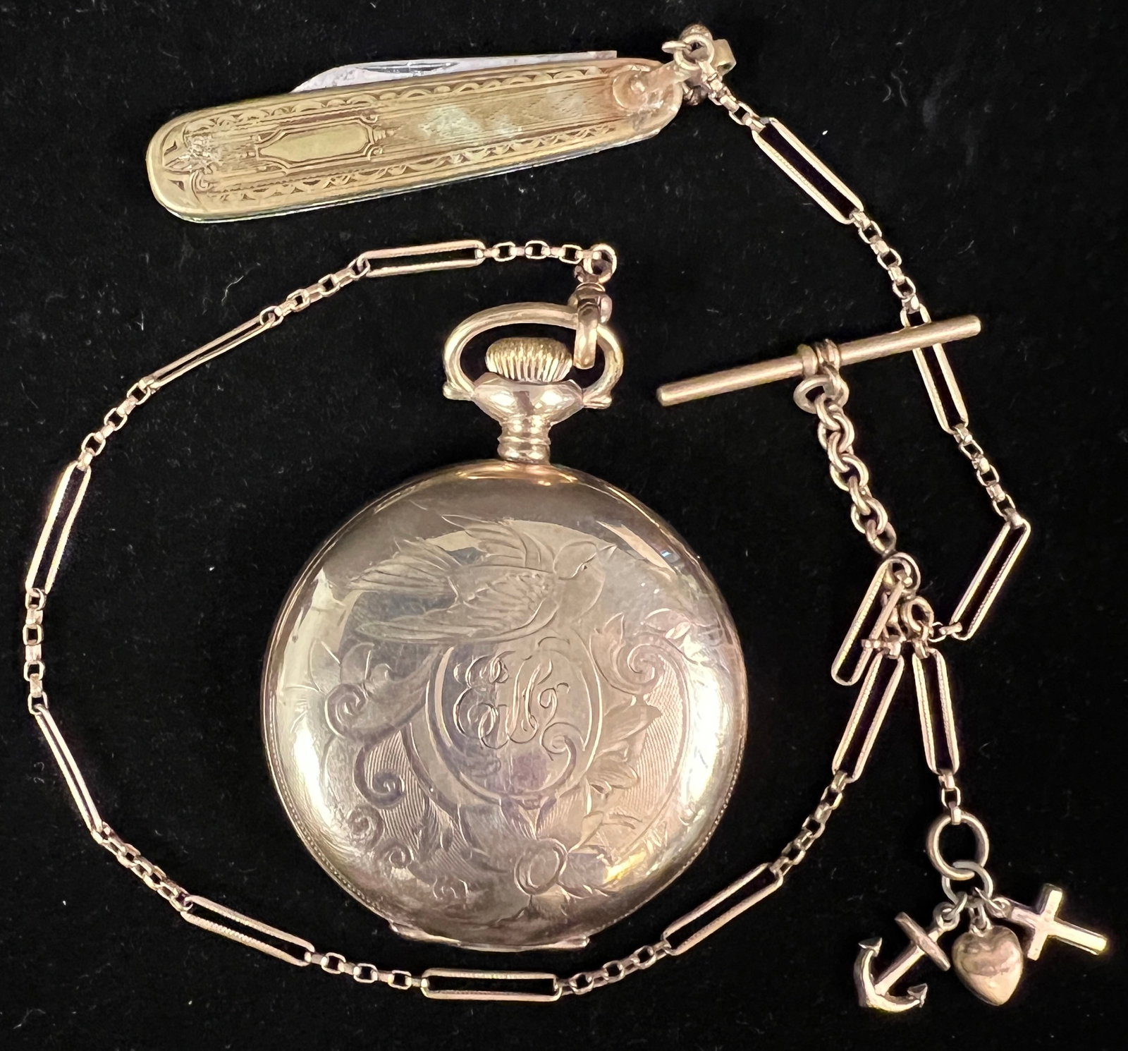 Victorian Gold Filled Pocket Watch w/ Ornate Fob: An Elgin Victorian gold filled pocket watch with fob, pocket knife, and gold filled charms. Watch does not work but case features elaborate chasing with scenes of sparrows and landscape. In as found c