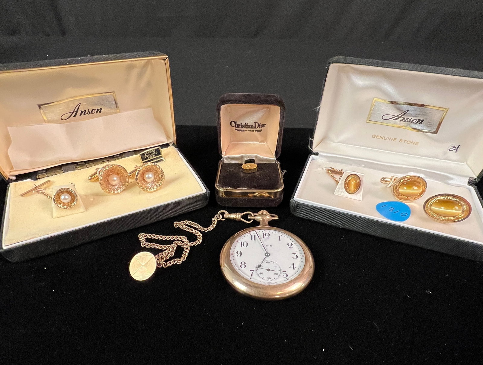Victorian Pocket Watch, Cufflinks, and More: An open face Elgin Victorian pocket watch with elaborate floral chasing (watch is not currently working). Also included are two sets of cufflinks with matching tie tacks and a Christian Dior tie tack 