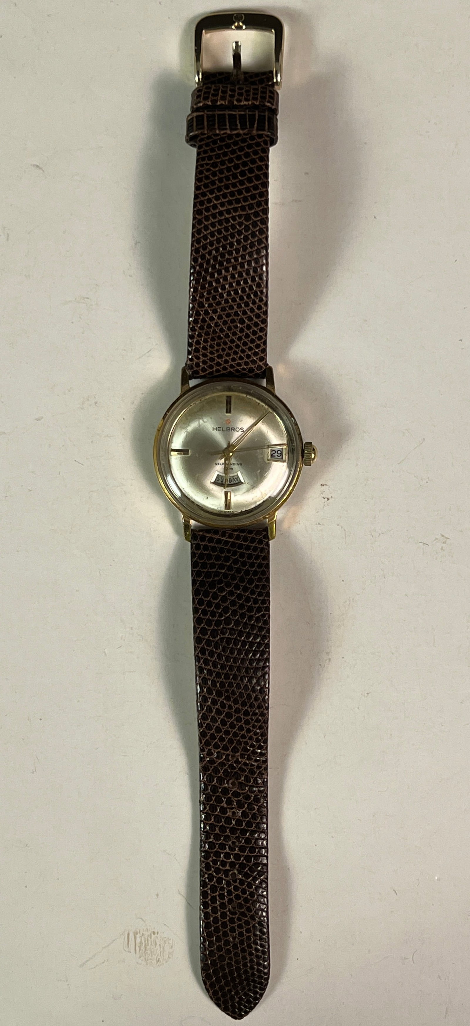 Helbros Vintage Self Winding Men's Watch: A vintage 1960s/70s Helbros self-winding watch in working condition. Does have some age wear but overall a nice watch, band is in excellent condition.