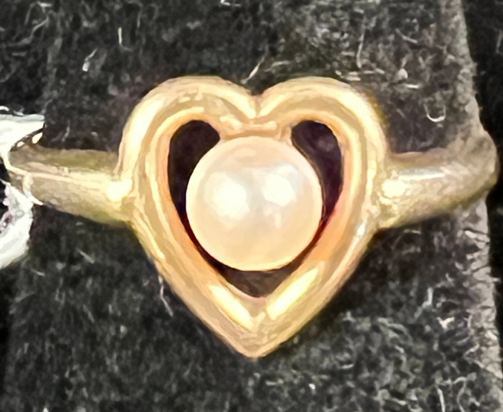 14k Pearl Heart Women's Ring: A 14K women's pearl and heart ring. Ring is a size 4.75 and weighs 2.17 grams.