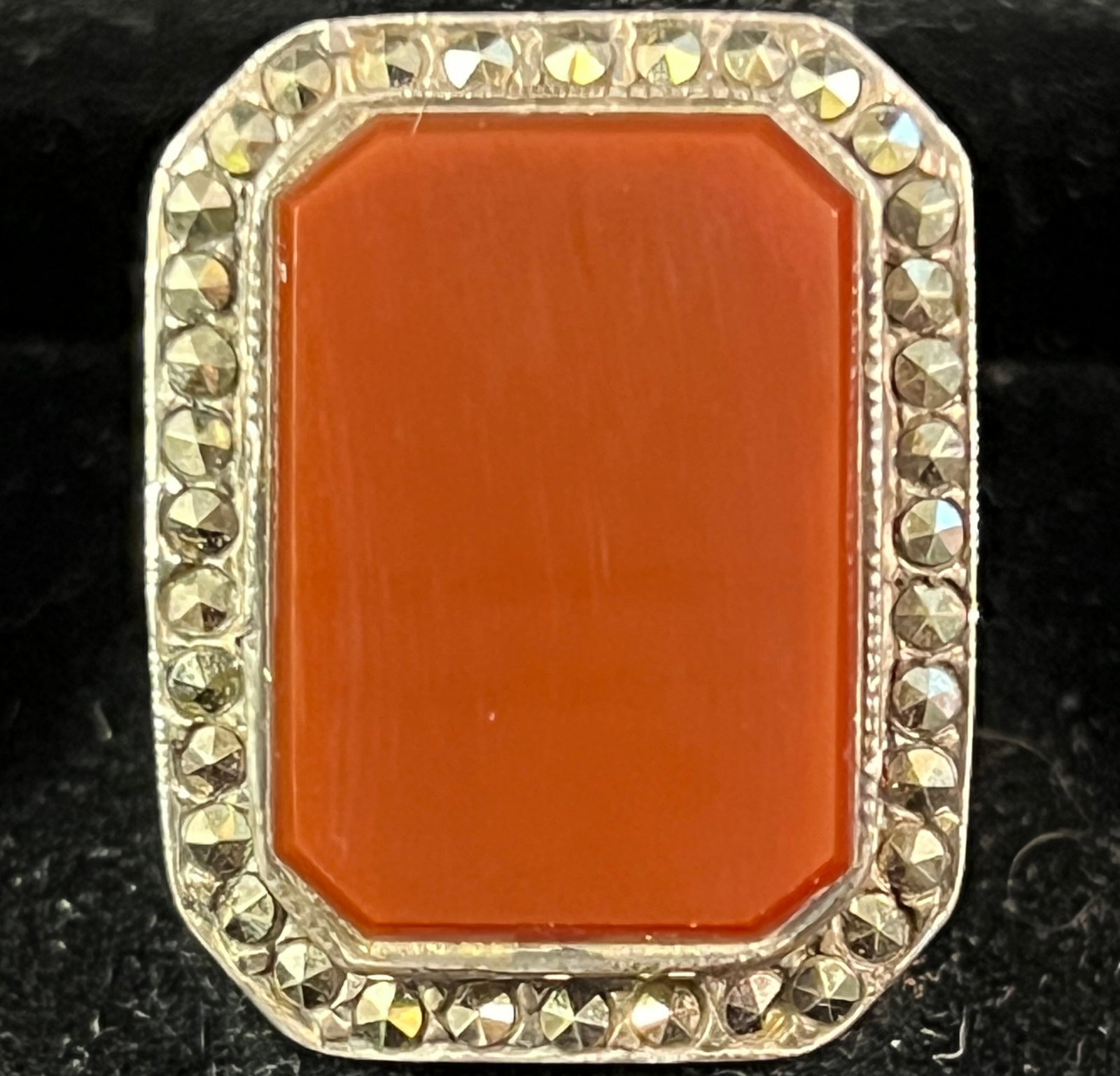 1920s Carnelian Sterling Marcasite Ring of Important Size: A 1920s carnelian sterling marcasite ring of important size, in excellent condition. This is a great example of Art Deco jewelry that makes a statement! This ring is size 8.75 and weighs 15.84 grams.