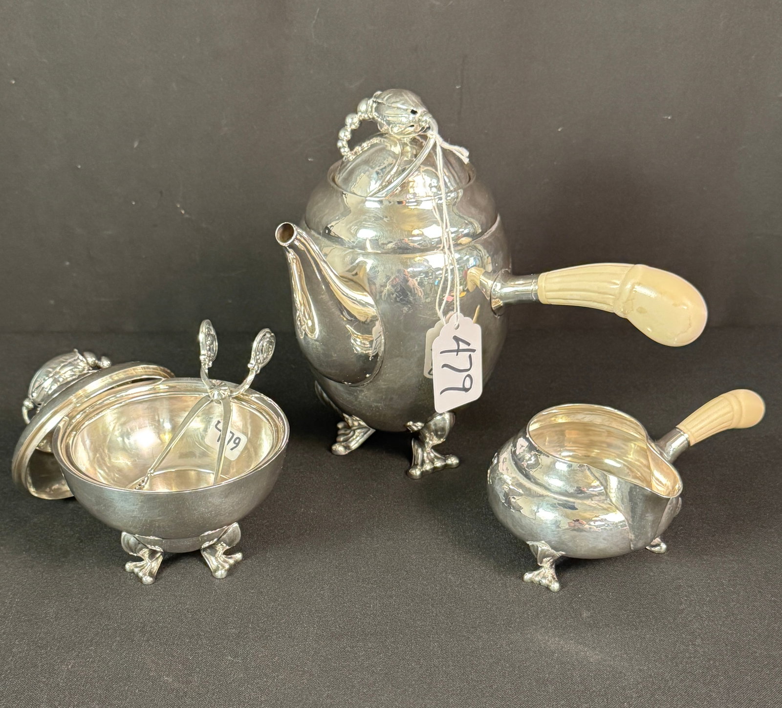 Georg Jensen 3 Piece Coffee/Tea Set: A rare Georg Jensen three piece coffee or tea set in the blossom pattern. This pattern was first introduced by the company in 1905 and is highly coveted by collectors of Georg Jensen silver. This outs