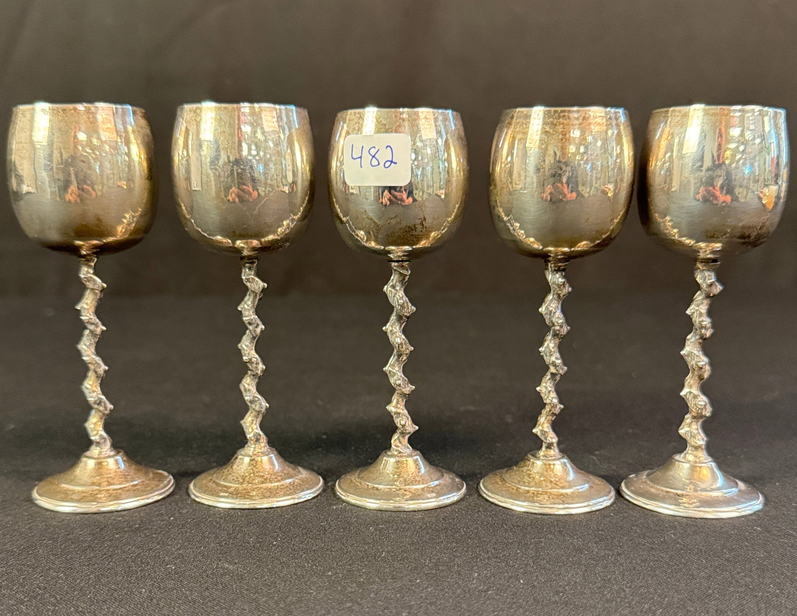 Set of Five Sterling Cordials: A set of five sterling cordials with stylized thorn twist stems. Each is stamped .925 on base and measures 4.25" tall and weighs 33.6g, for a total weight 168 grams.