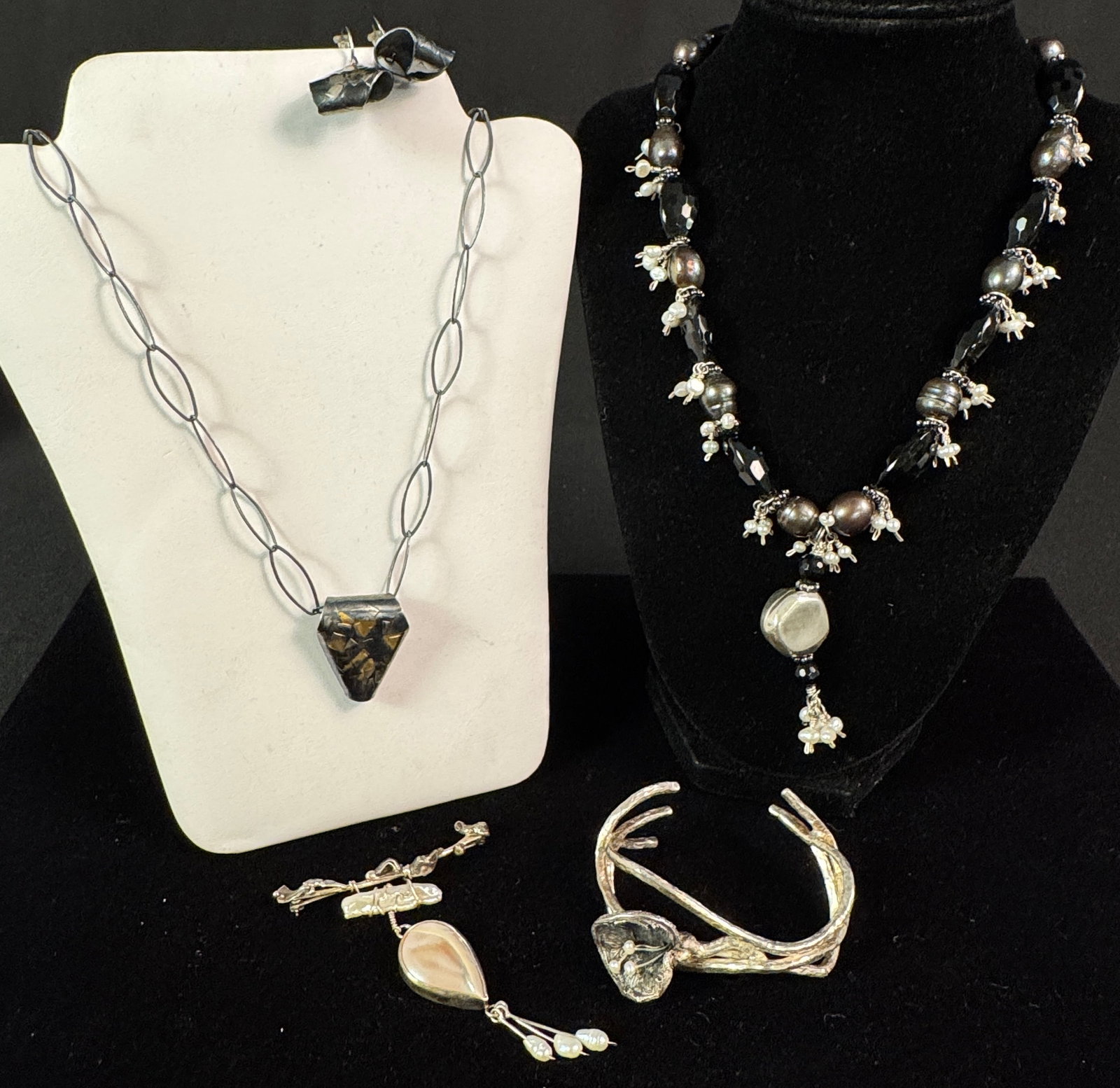 Handmade Pearl Brooch, Calla Lily Cuff Bracelet, and More: A group of high quality jewelry to include a handmade, abstract sterling and pearl brooch signed by maker, an unmarked Brutalist calla lily silver and pearl cuff bracelet, a black pearl, sterling and 