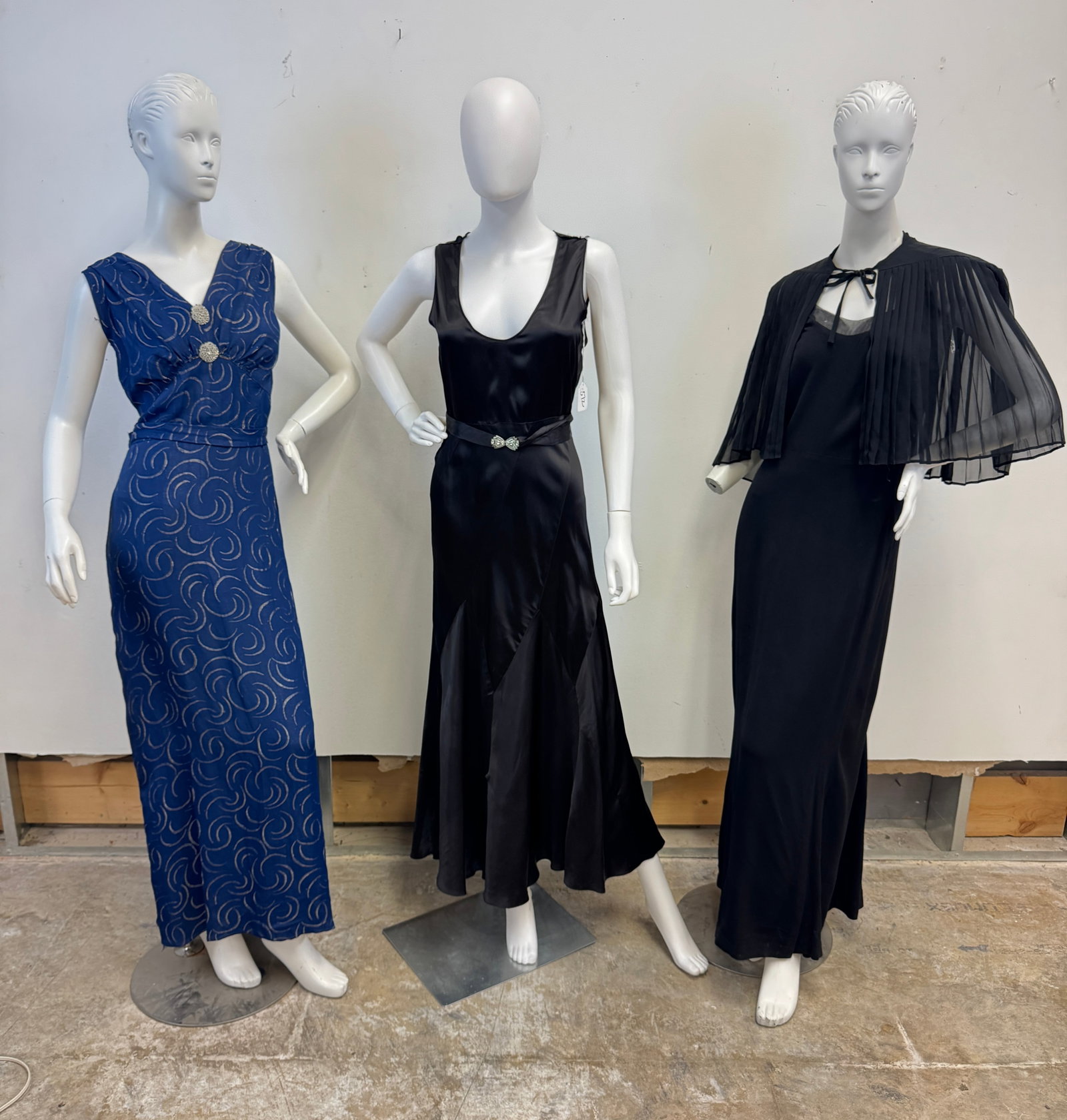 3 Ladies Gowns C.1920/30's: A group of vintage ladies evening gowns to include a black bias cut sleeveless evening gown with rhinestone buckle belt, a late 1920's sheer black ladies floor length V neck gown with matching pleated