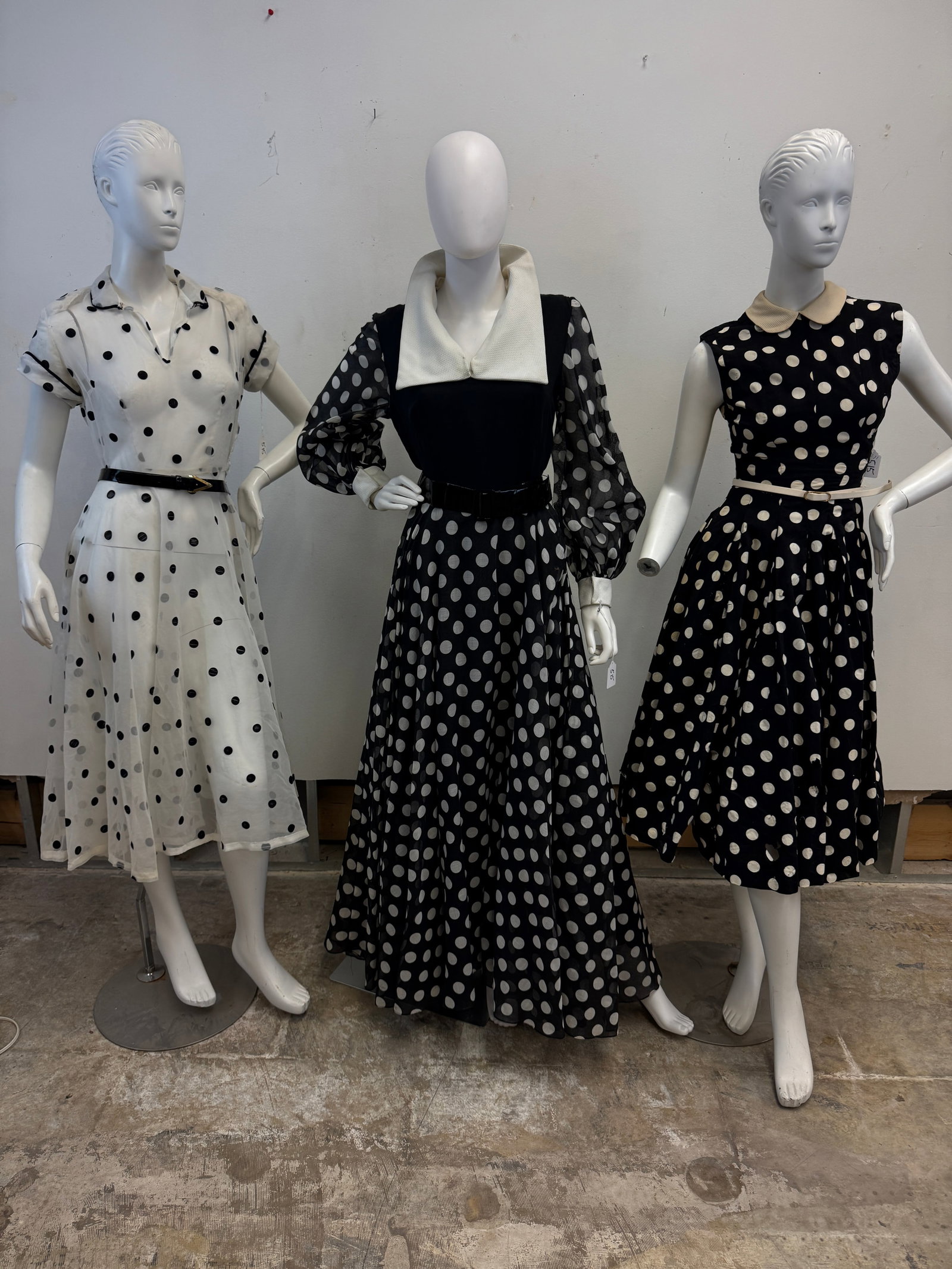 3 Vintage Polka Dot Dresses: 3 Vintage black and white polka dot dresses to include a sheer white 1950's knee length dress with black flocked polka dots and side zipper (very good Condition), a 1960's floor length polka dot gown 