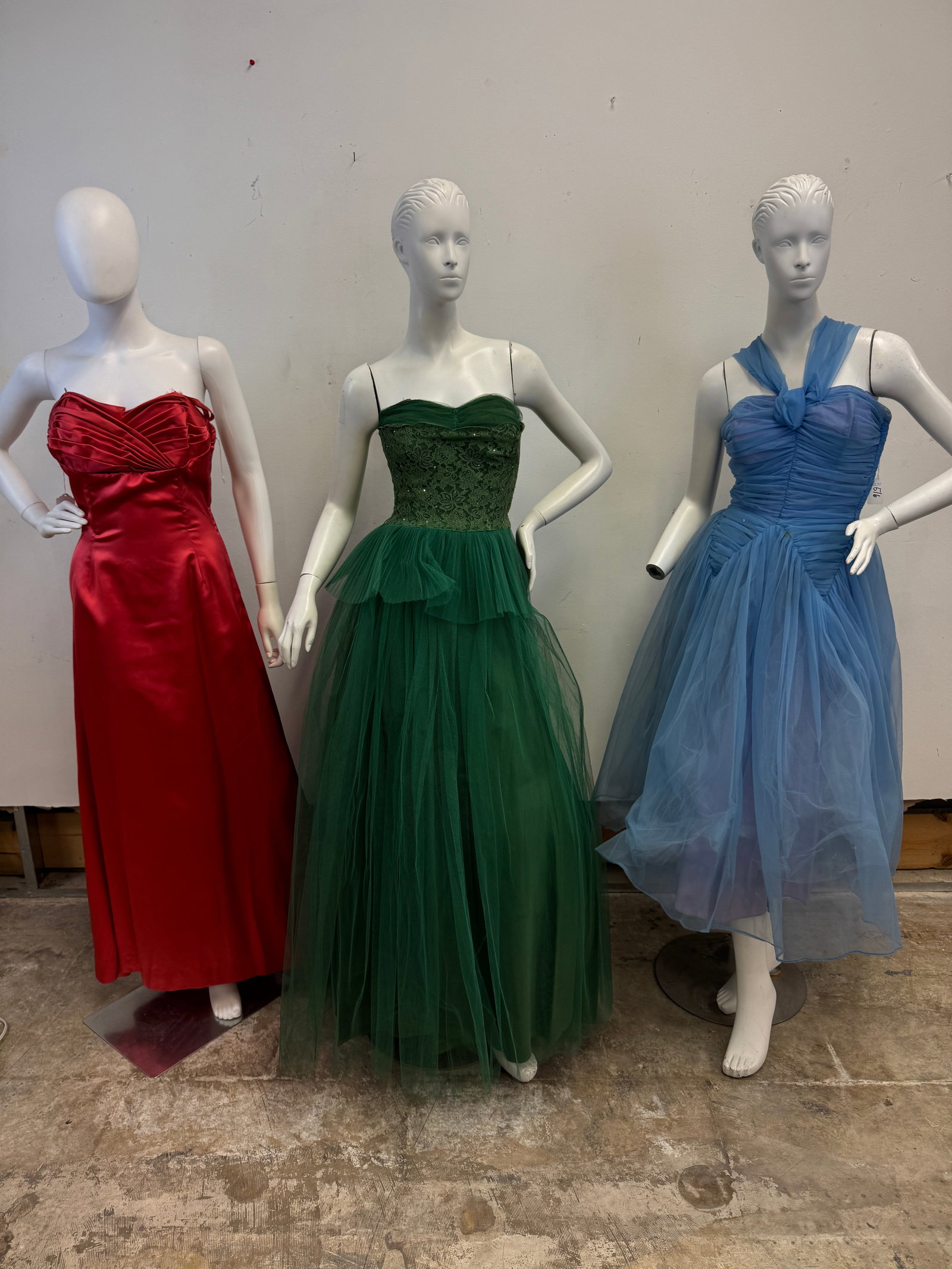 3 Vintage Party Dress c1950's: 3 Vintage party dresses c.1950's to include a satin coral strapless floor length gown with a pleated bodice and a rhinestone buckle train (excellent Condition), a sleeveless green party dress with lac