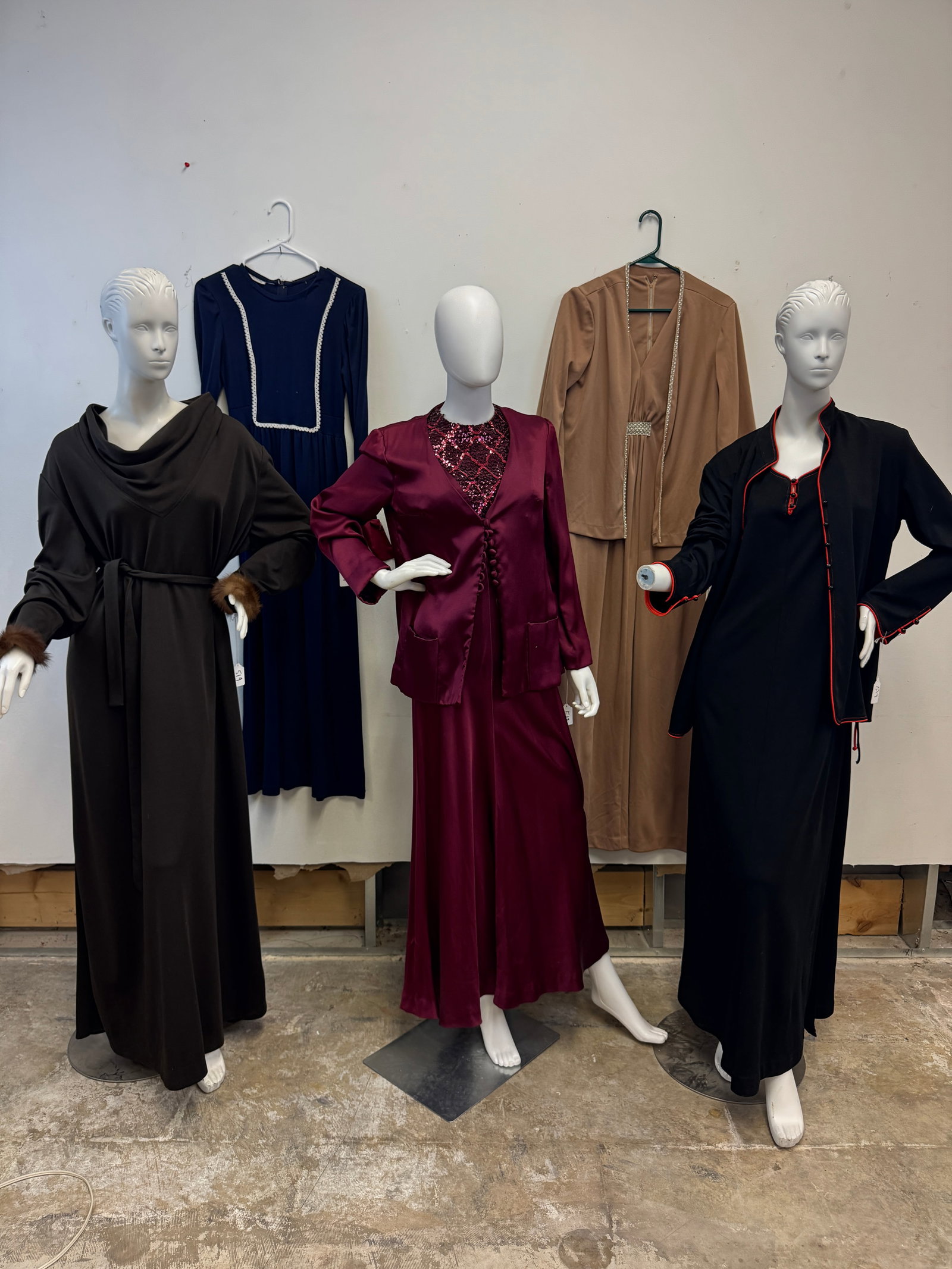 Ladies Vintage Gowns and Maxi Dresses C1960/70's: A Group of ladies vintage gowns and maxi dresses c.1960/70's to include a Lee Jordan New York Burgundy satin sleeveless maxi dress with a diamond pattern sequin bib, and matching jacket, a dead stock