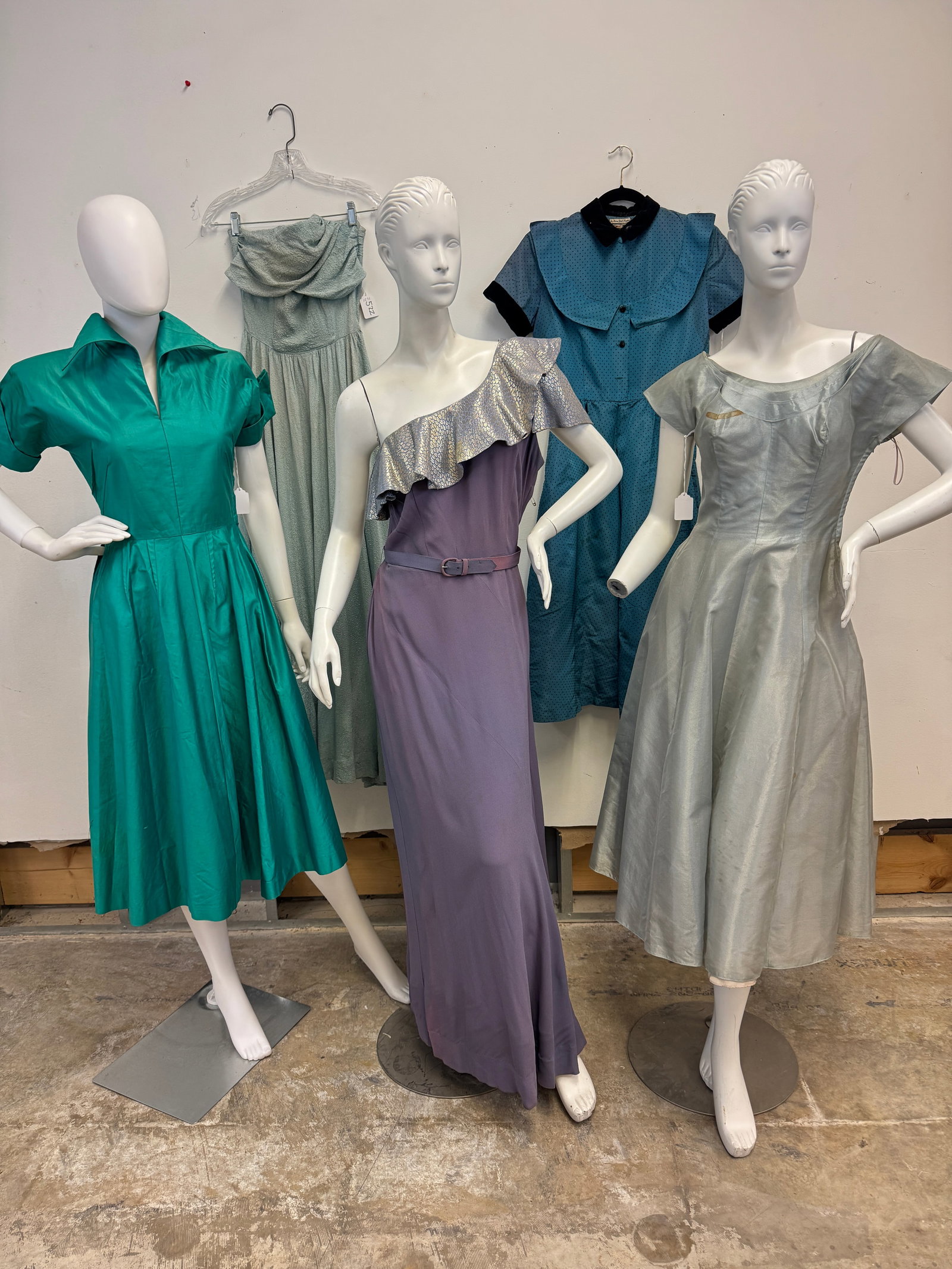 Vintage group of 1940/50's Dresses: A group of vintage ladies 1950/50's dresses to include a late 1940's sky blue textured strapless fitted gown with an Aline skirt and draped bodice in good Con.), a 1940's Kahn of Minneapolis green pol