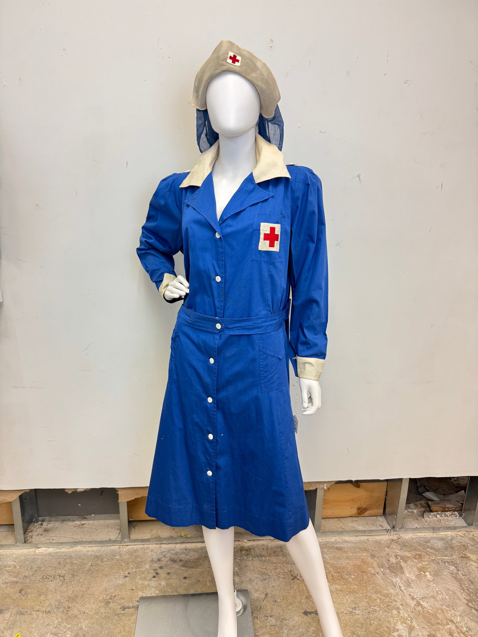 Ladies American Red Cross Nurses Uniform circa WWll: A WWll Red Cross blue cotton Nurses Uniform and 3 nurses veils in good condition