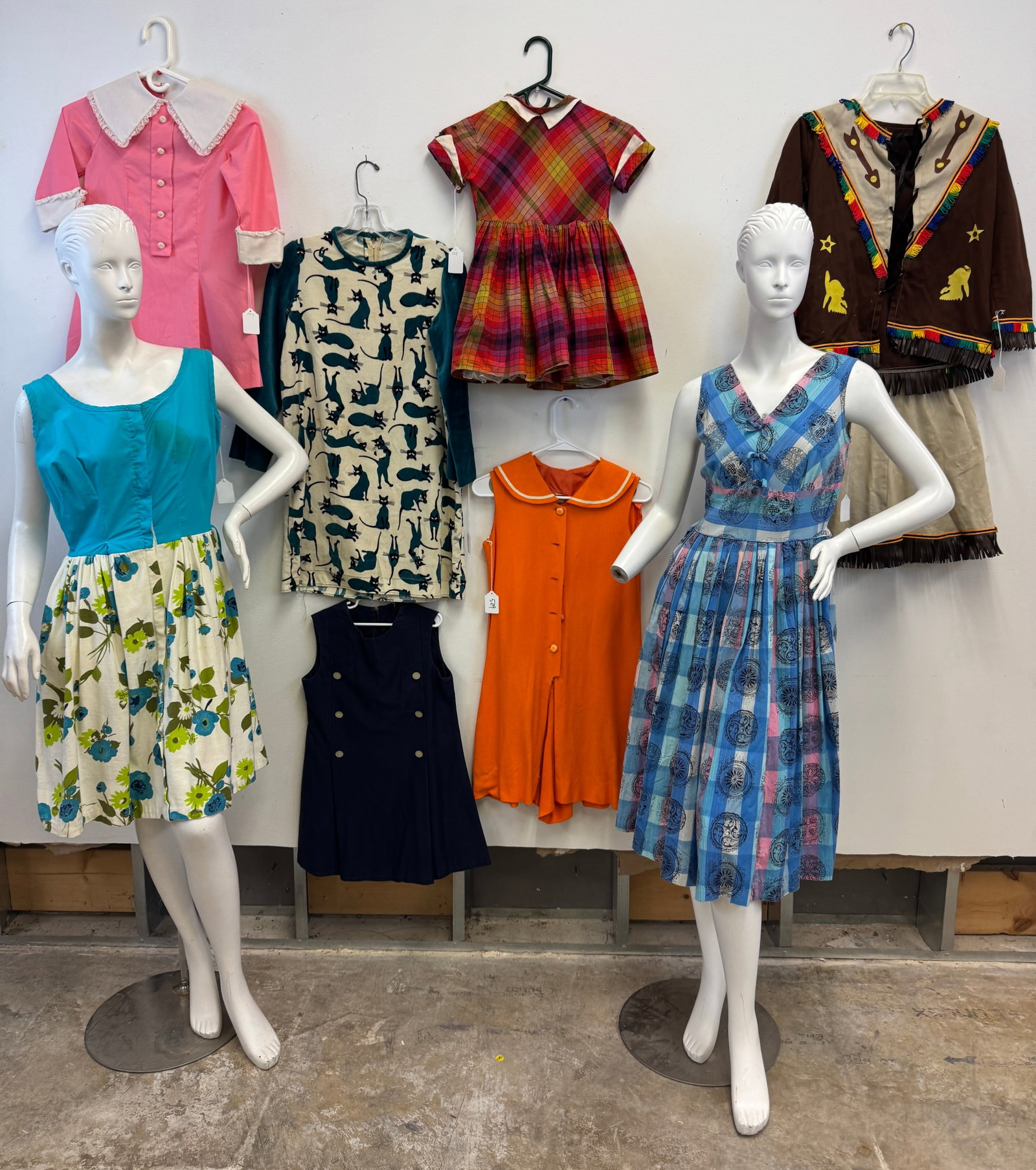 Group of Vintage Children's Clothing C1950/60's: A large group of vintage cotton children's clothing from the 1950's and 60's to include little girls dresses and young adult dresses, and highlighting a velour long sleeve dress with Siamese cat patte
