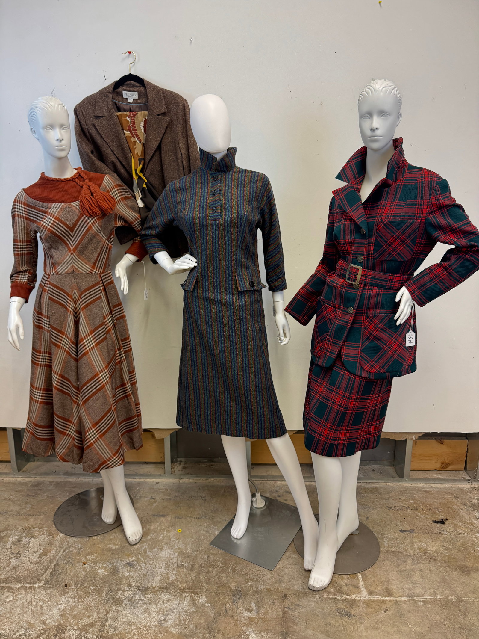 4 Vintage Ladies Garments, Hats c.1960's: 4 Vintage 1960's ladies garments to include a brown wool Carlyle fit and flair dress with diagonal plaid pattern and full skirt, a wool Kahn of Minneapolis brown, purple and blue striped dress, a Davi