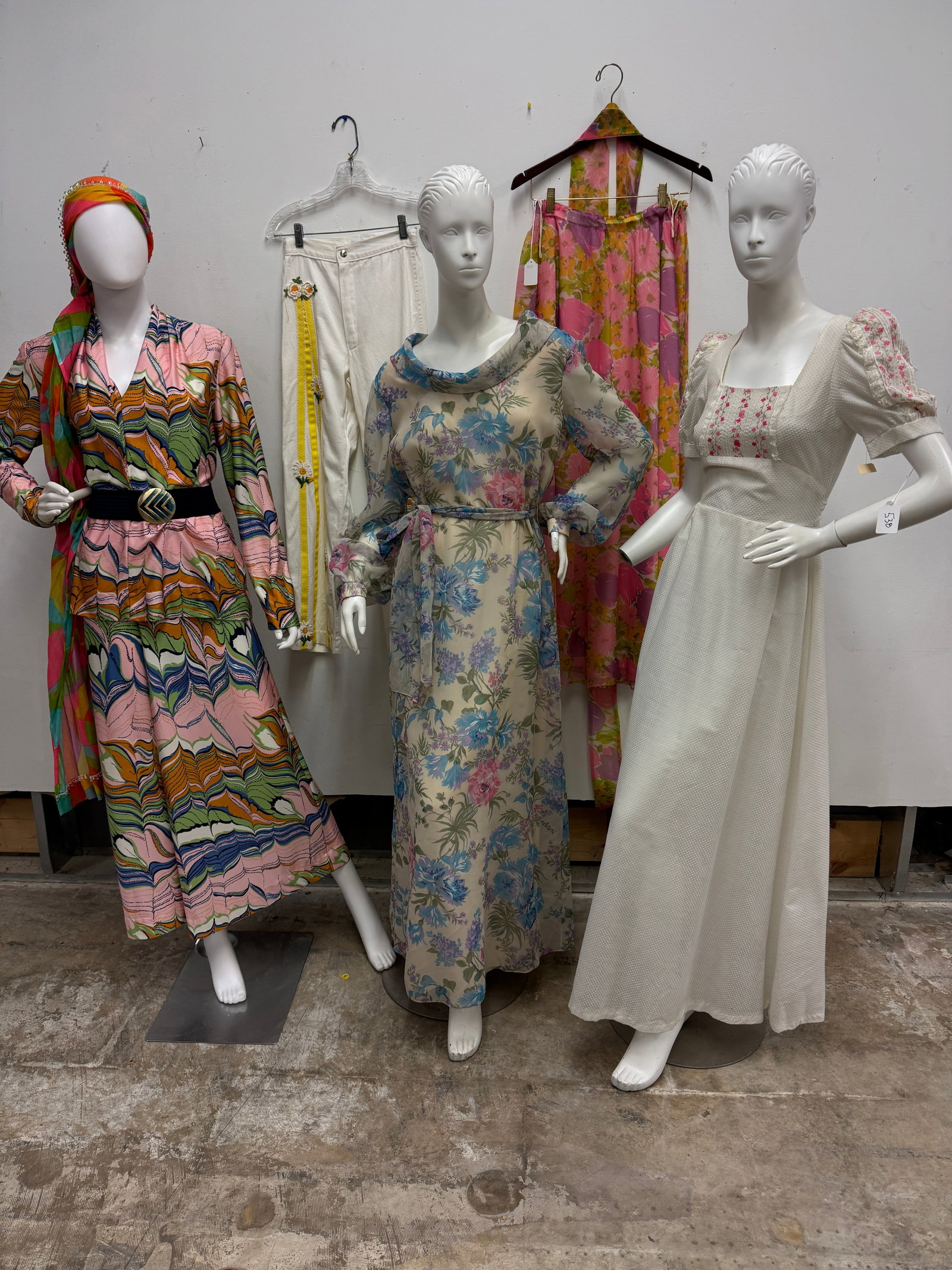 Group of 1960's floral dresses, More!: A group of late 1960's floral dresses to include a psychedelic 2 pc top and pants set by Carillon New York with a long cotton scarf with hanging crystal embellishment, a Swiss dotted white maxi dress 