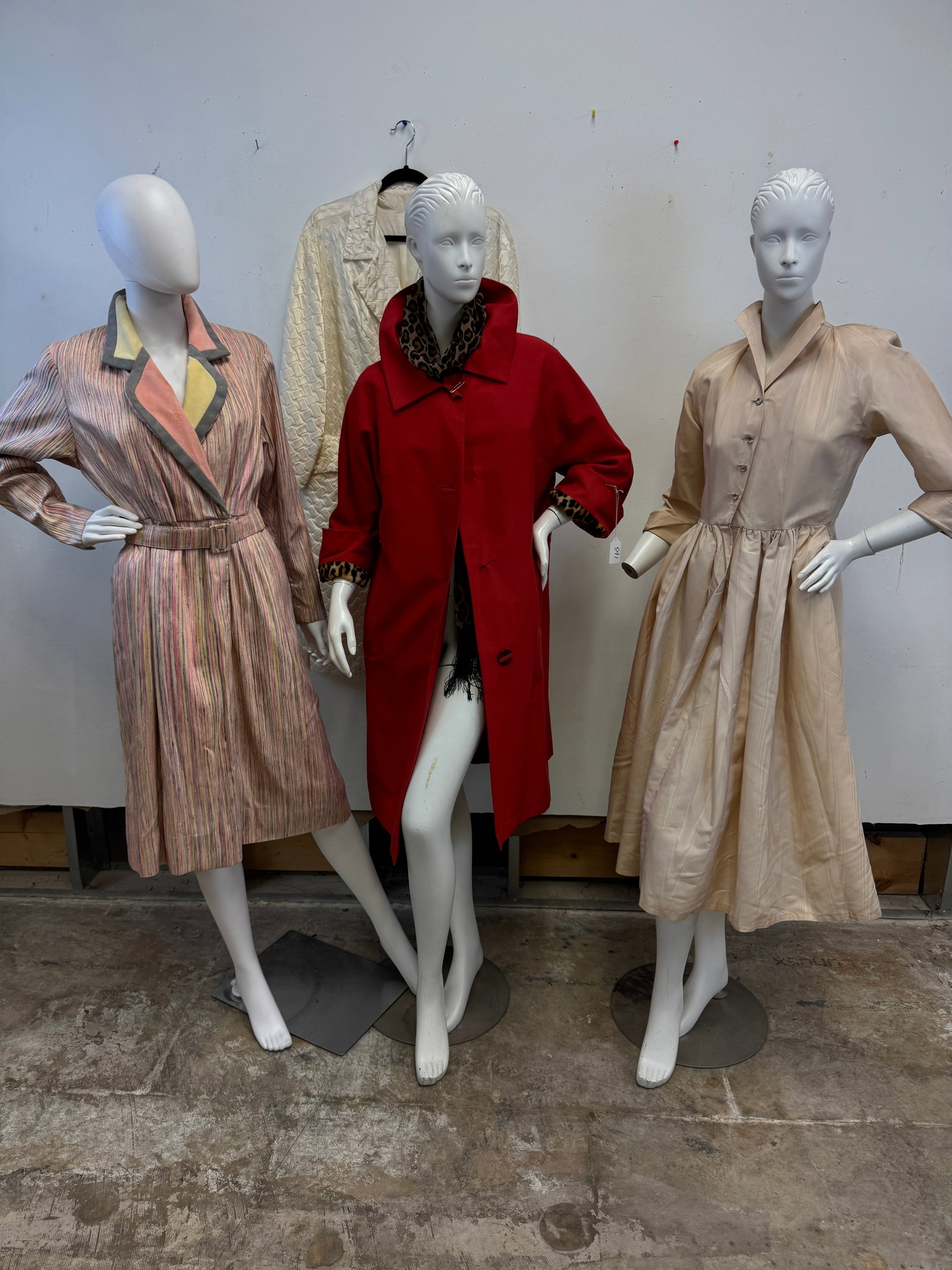 Ladies Vintage Coats and Dresses C1960's: A quality group of ladies Vintage 1960's garments to include an Indra of Paris red coat with a cotton leopard fur lining, a white satin basket weave textured Rain-Paca raincoat, a white more taffeta f
